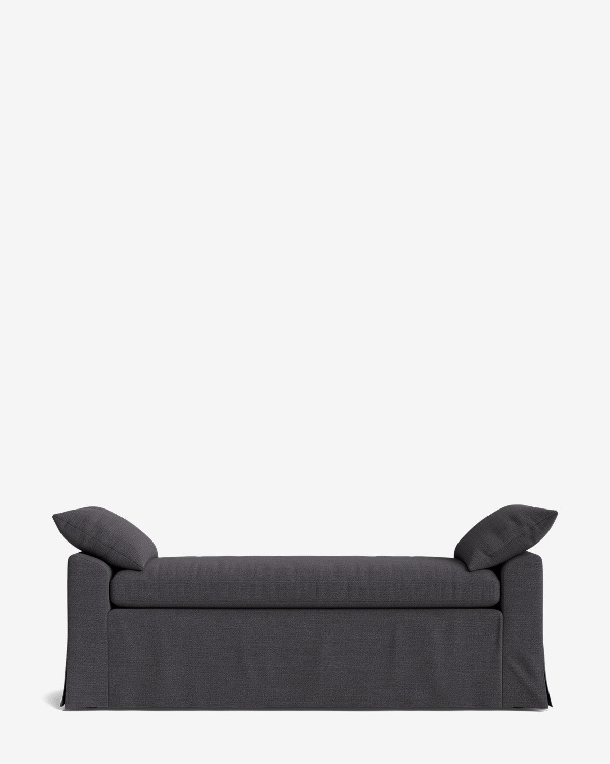 The Scaletta Bench features dark gray performance upholstery, a skirted base, and comes with two matching pillows at each end, shown against a plain white background, by McGee & Co.