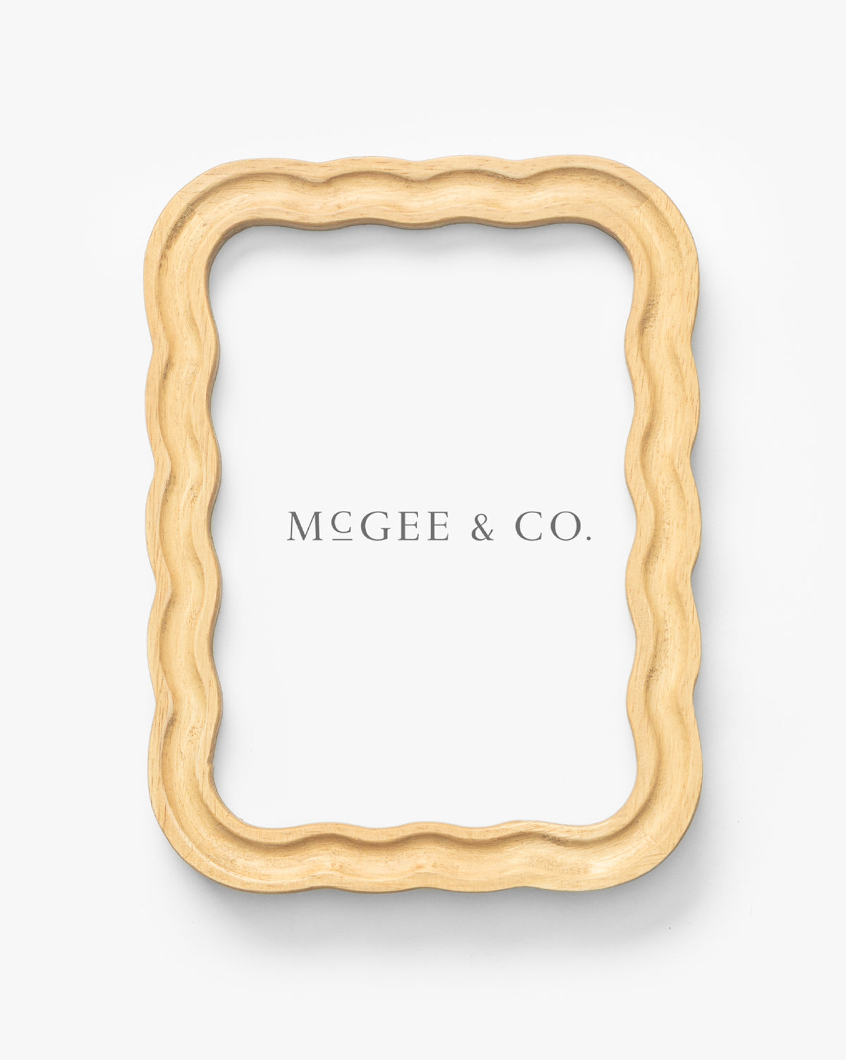 The Scalloped Wood Frame, made from natural rubberwood, features a white background with “MCGEE & CO.” in gray serif font—a stylish accent for your home decor, by McGee & Co.