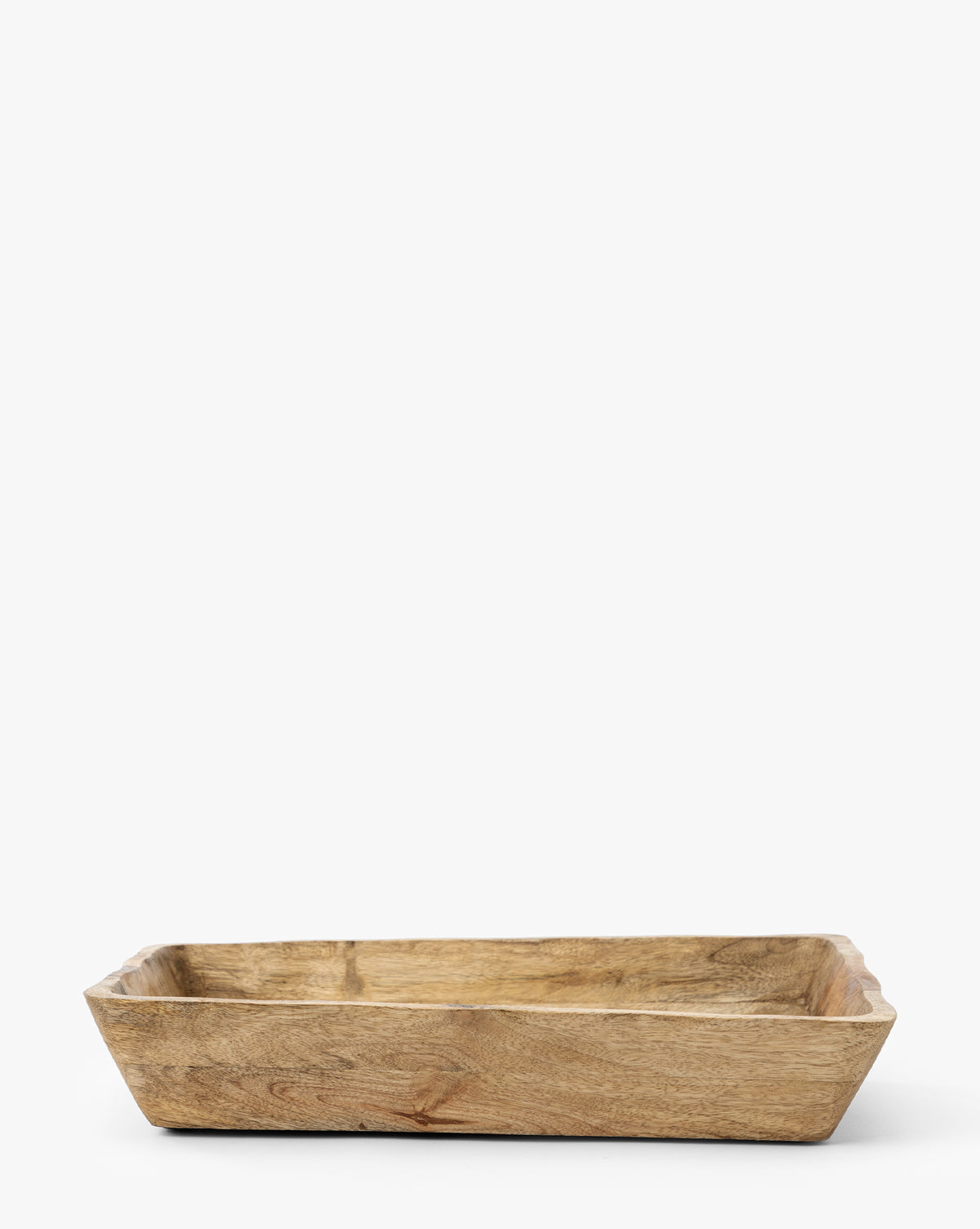 The Scalloped Wood Tray is a rectangular, shallow handcrafted mango wood tray featuring smooth, natural grain, shown on a plain white background by McGee & Co.