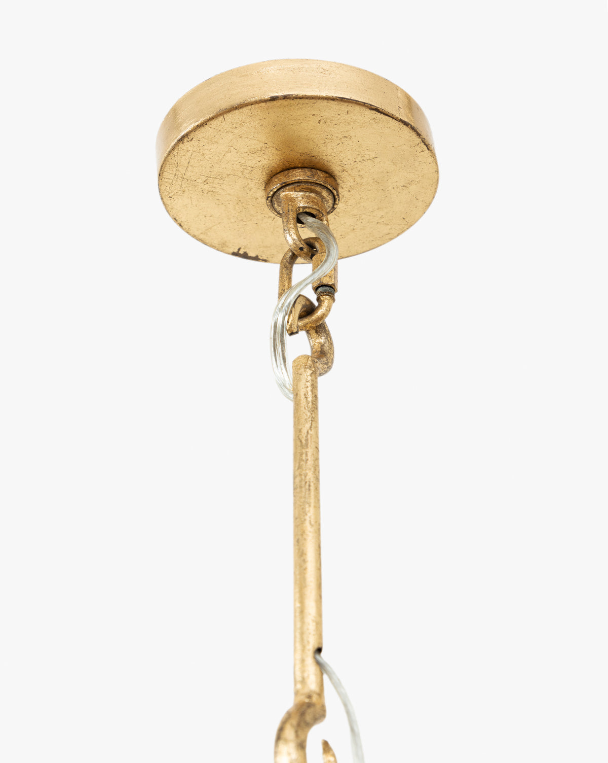 Close-up of the Scarlett Pendants gold leafed iron ceiling canopy, featuring an attached metal chain and rod, set against a plain white background, by McGee & Co.