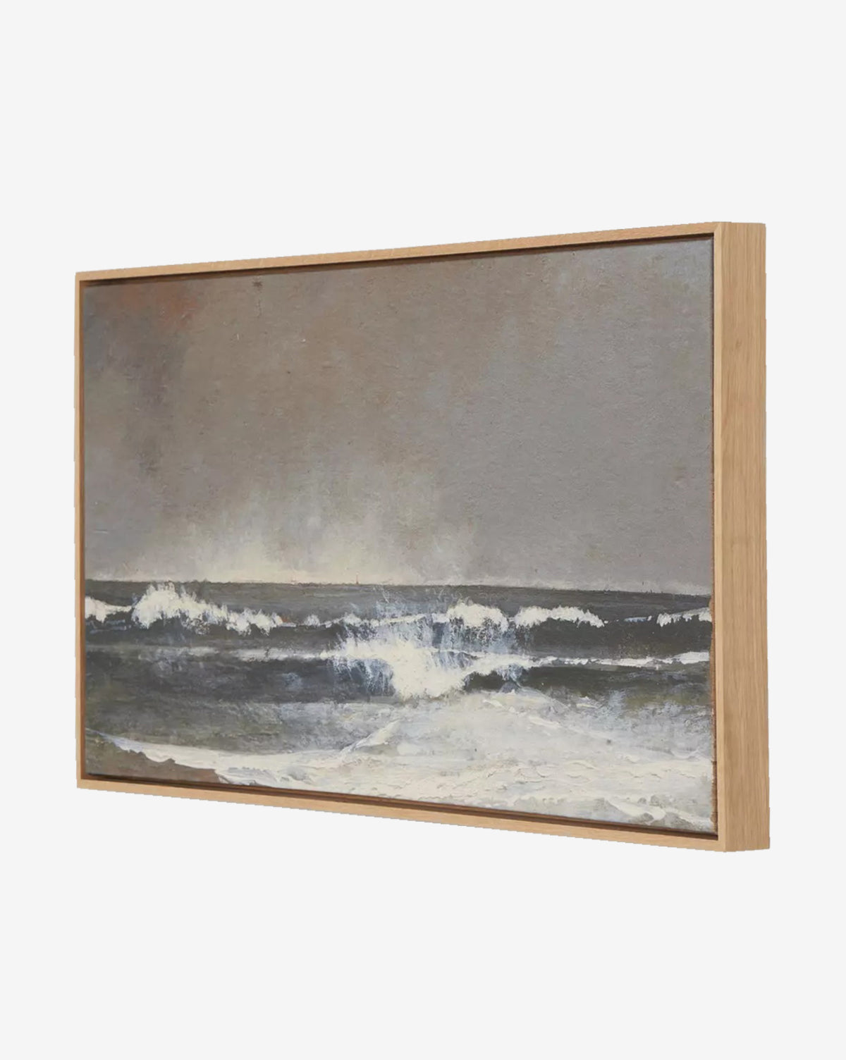 Seafoam by Aileen Fitzgerald: a framed seascape painting of ocean waves crashing under a cloudy gray sky, accented with white foam and set in a sleek white oak frame—an elegant addition to any home decor, by McGee & Co.