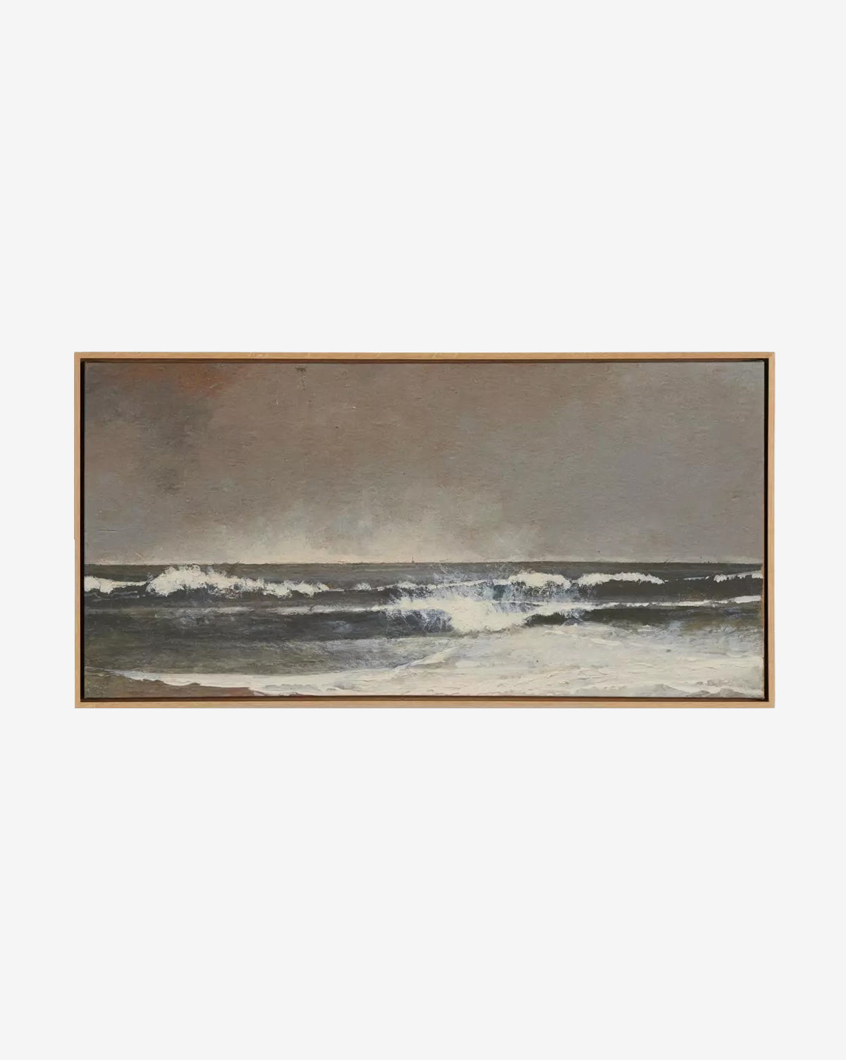 Seafoam by Aileen Fitzgerald depicts ocean waves crashing beneath a cloudy sky in muted, earthy tones with swirling white foam. This seascape comes in a simple white oak frame—ideal for adding style to any home decor, by McGee & Co.