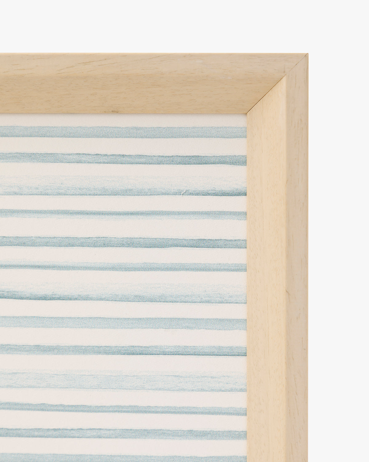 A close-up of the Seaside Village frame showcases its light wood and artwork with horizontal blue and white stripes, making it a charming coastal accent ideal for playroom decor, by McGee & Co.