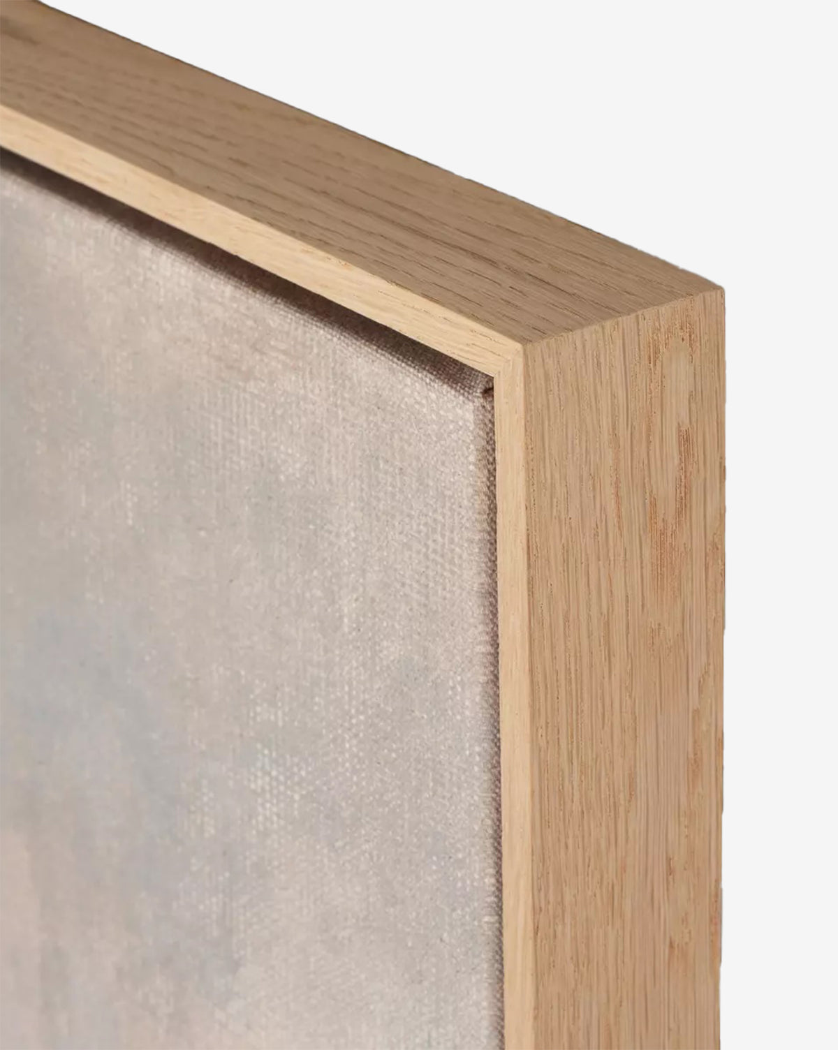 Close-up of the corner of Seeing in Color by Aileen Fitzgerald, a stretched canvas artwork with a light white oak frame. The canvas texture, detailed brushwork, and subtle wood grain appear vividly against a plain white background, by McGee & Co.