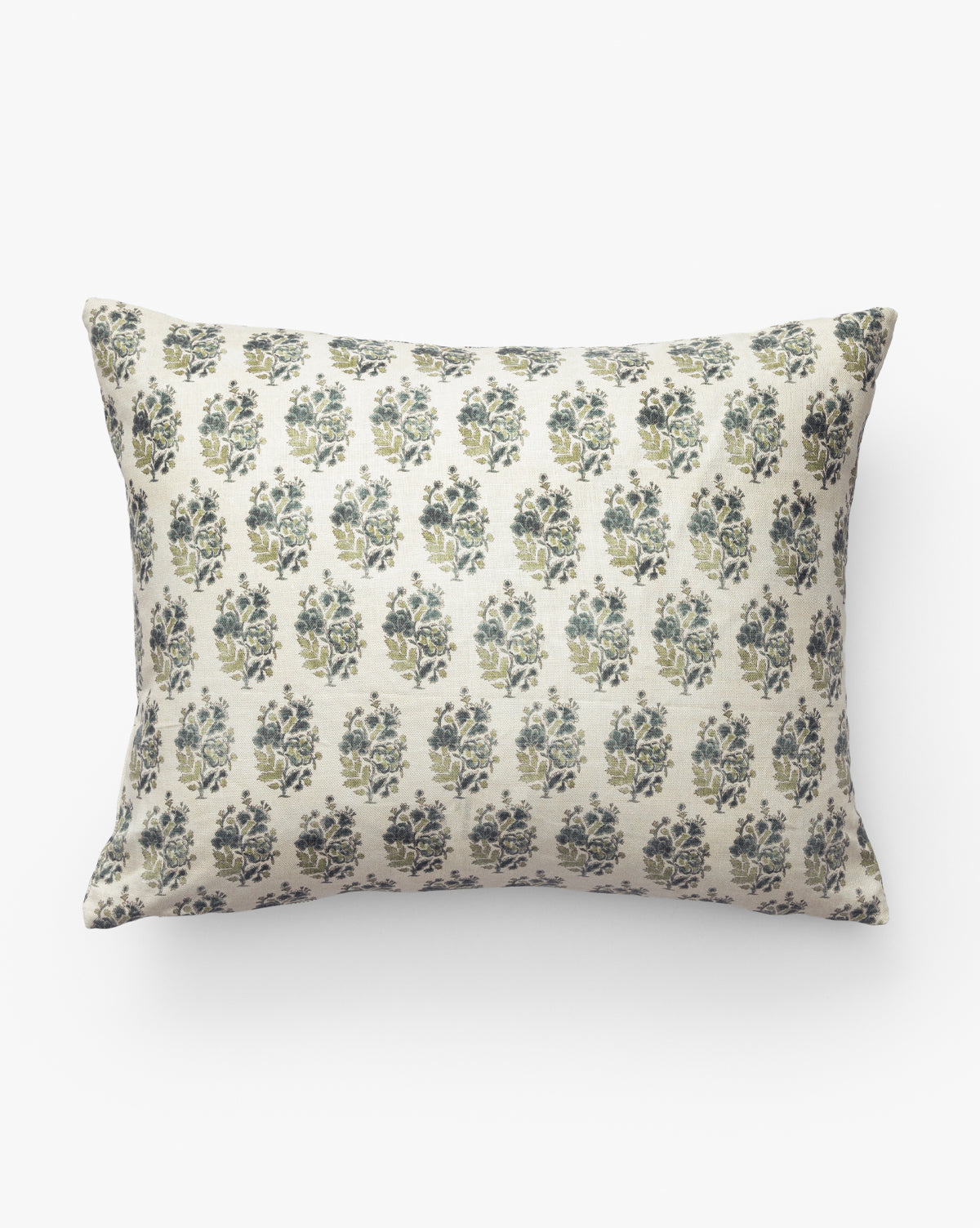 The Selah Pillow Cover is a rectangular linen pillow with a beige background and a repeating pattern of small dark blue and green floral bouquets—an elegant accent for classic living room decor, by McGee & Co.