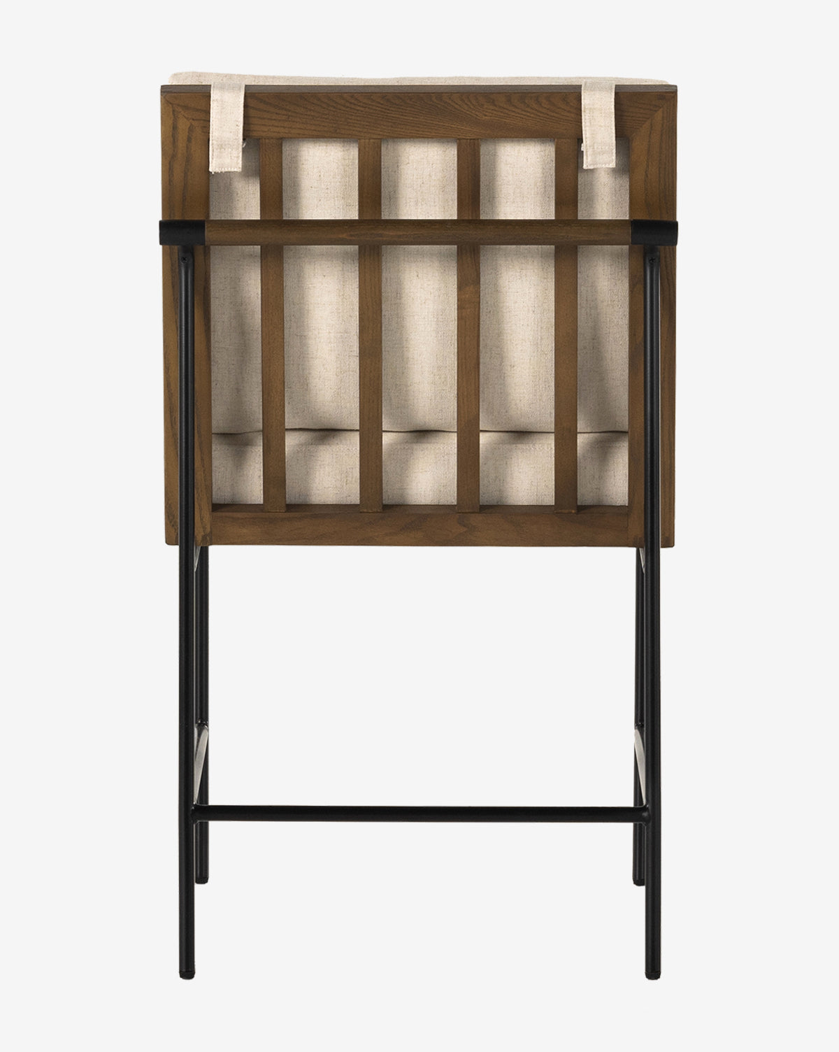 The Selas Dining Chair showcases a wooden frame, light beige high-performance fabric with button accents, and black-finished iron legs, viewed from the back for a modern look, by McGee & Co.