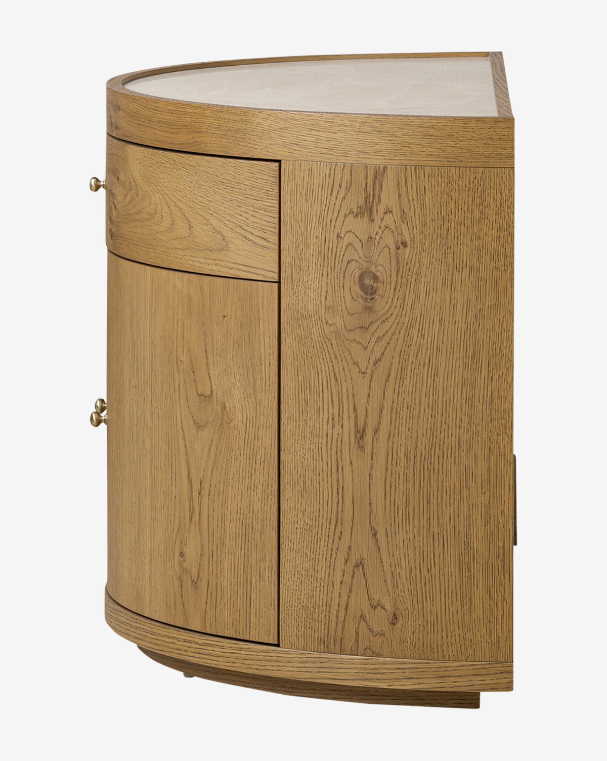 The Selma Nightstand is a wooden corner cabinet with a curved front, visible wood grain, a drawer, door, and round metal knobs. Its smooth top and natural finish highlight the oak veneer craftsmanship by McGee & Co.