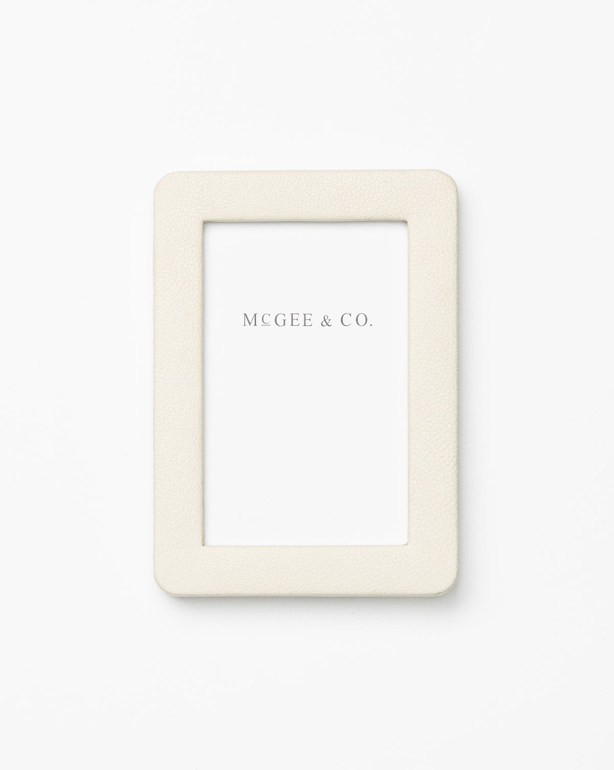 The Shagreen Picture Frame is a rectangular, cream-colored frame with a textured surface, showcasing a blank placeholder card labeled MCGEE & CO. in gray text on a white background.