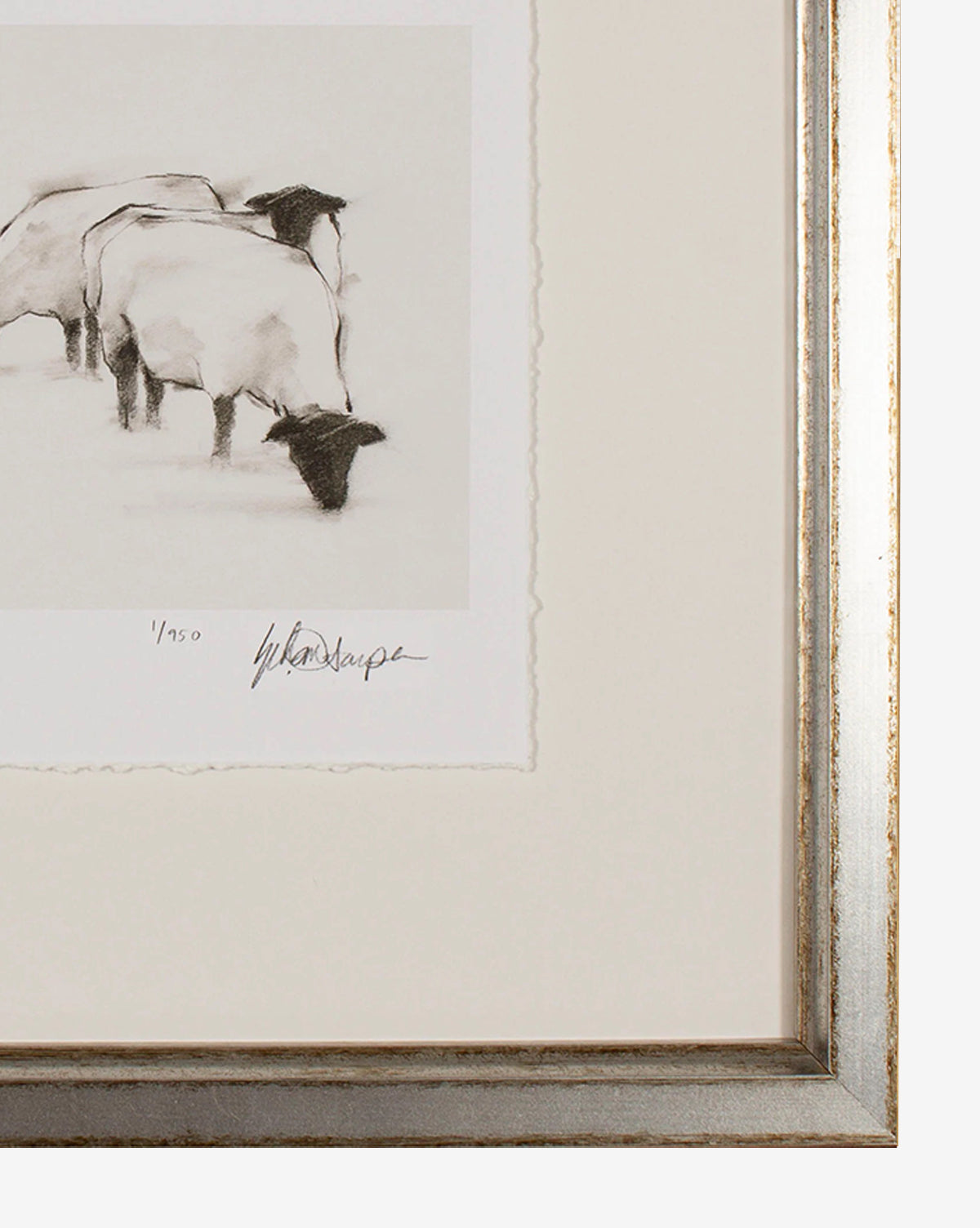 Sheep II is framed wall art featuring a sheep sketch with three grazing sheep, two partly outside the frame. Signed and numbered 1/50, it comes in a silver frame with off-white mat—ideal for a childs room or cozy decor.
