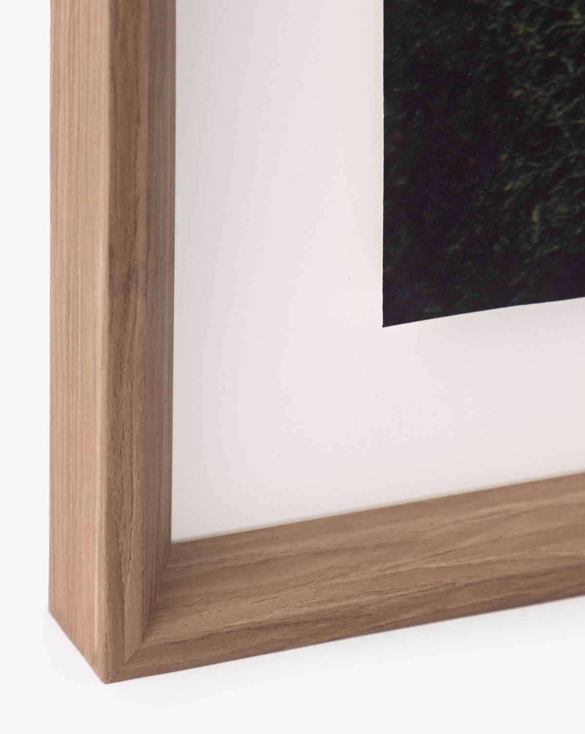 Close-up of the corner of a natural wood frame with a white mat, featuring part of the Shimmer of Wave giclee print inside—an ideal detail for stylish wall art.