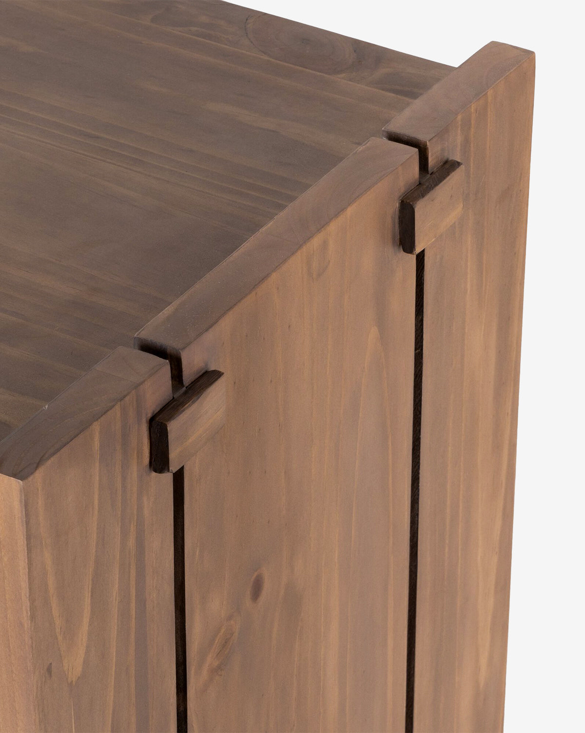 Close-up of the Sloane Sideboard corner, highlighting interlocking joints and a smooth, natural solid pine wood grain finish, by McGee & Co.