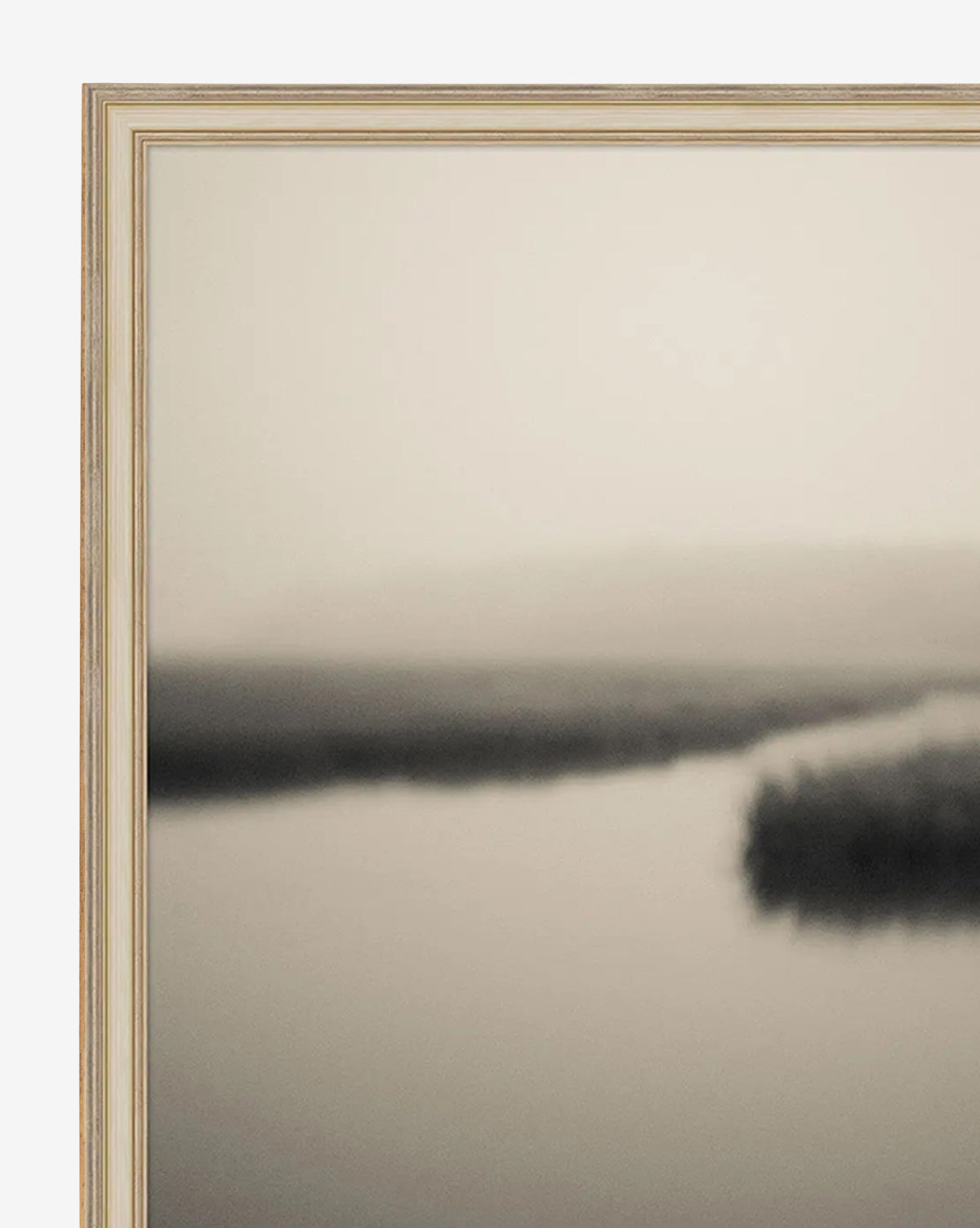 Soft Atlantic Coast by Susan Currie is a gallery-quality giclee on canvas. Framed, it features a serene, sepia-toned coastal landscape with calm water and a hazy sky, offering peaceful, minimalist décor by McGee & Co.