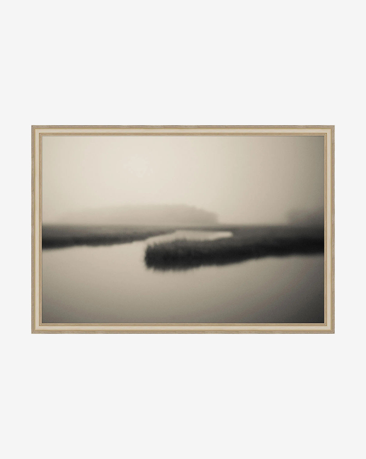 Soft Atlantic Coast by Susan Currie is a framed, black and white giclee on canvas featuring a blurred calm river winding through misty marshland, perfect for creating a serene and minimalist atmosphere, by McGee & Co.