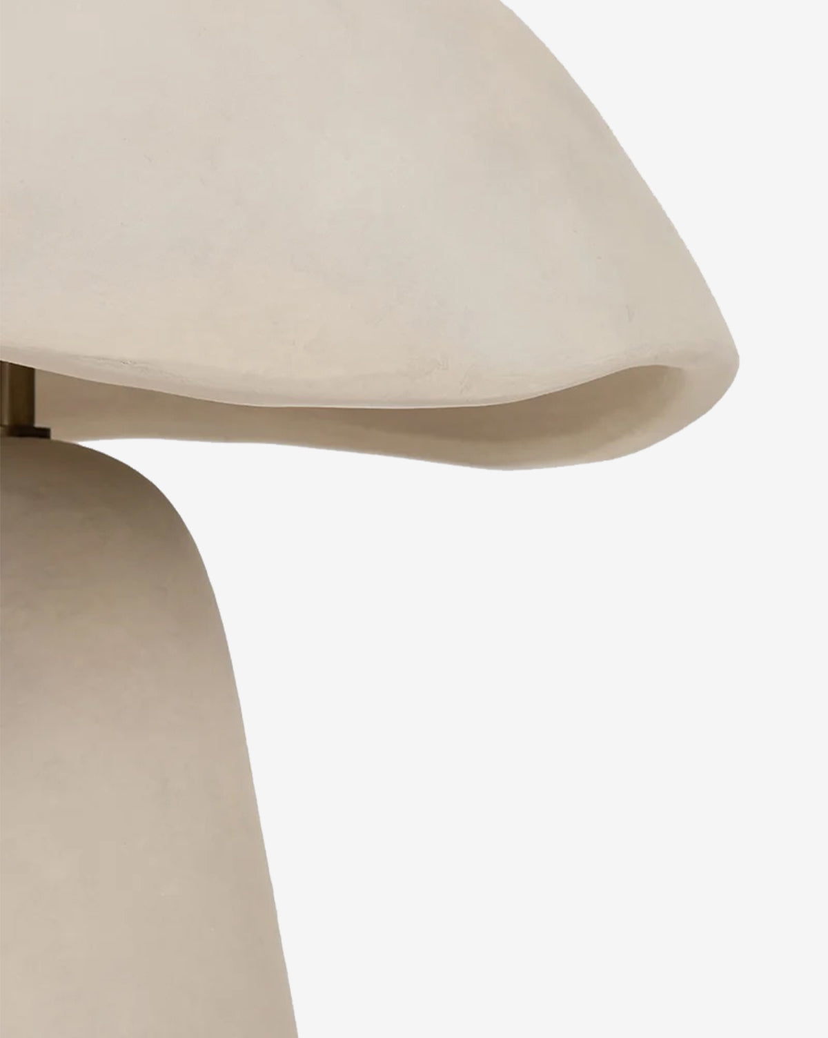 Close-up of the Soloma Table Lamp, a contemporary artisan piece crafted in white ceramic with a smooth, curved, sculptural form and beige tones, displayed against a plain white background by McGee & Co.