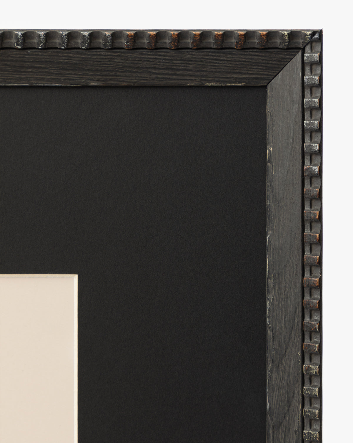 Close-up of the top right corner of the Spirit black textured picture frame with a beaded edge and white mat board inside—ideal for displaying wall art or a striking horse portrait, by McGee & Co.