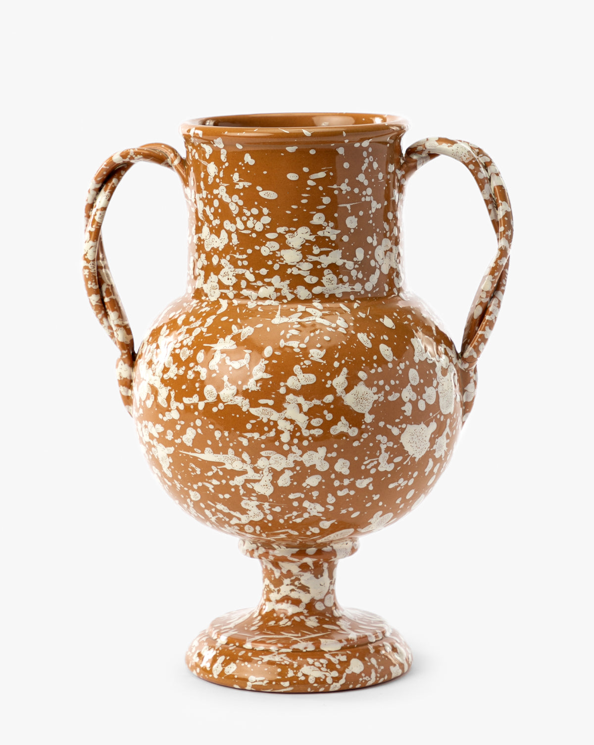 The Splatter Verona Vase is a handmade brown terracotta vase with two side handles, a rounded body, and white splatter patterns on a pedestal base, by McGee & Co.