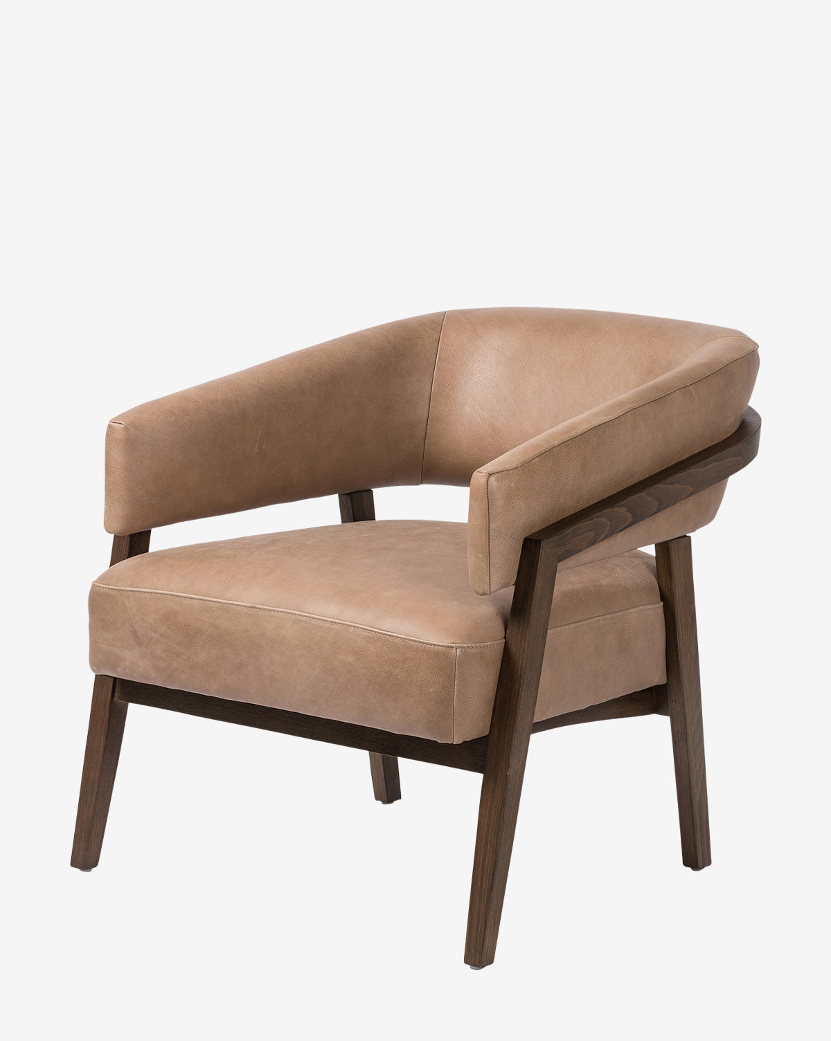 The Stanley Lounge Chair features tan leather upholstery, an open-back contemporary design, and angled dark wood legs and armrests, set against a plain white background by McGee & Co.
