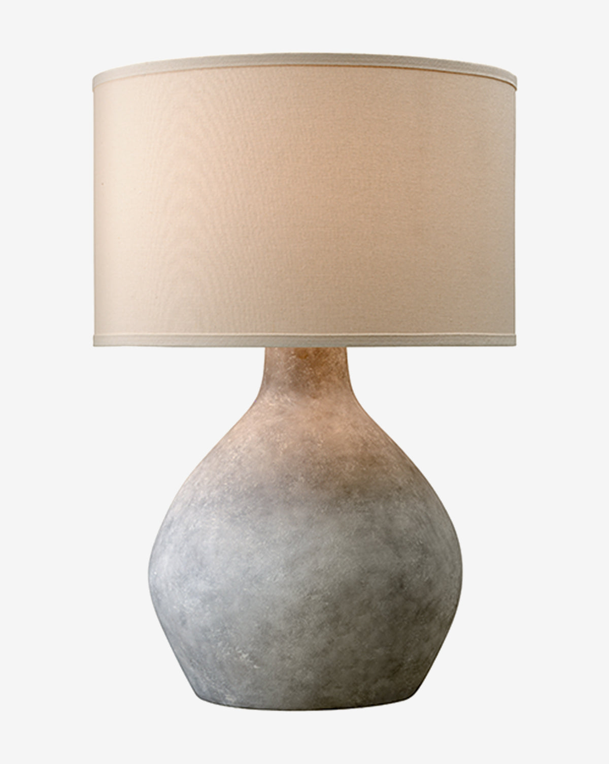 The Stetson Table Lamp showcases a textured gray ceramic base with a large fabric drum shade, offering a bold minimalist silhouette by McGee & Co.