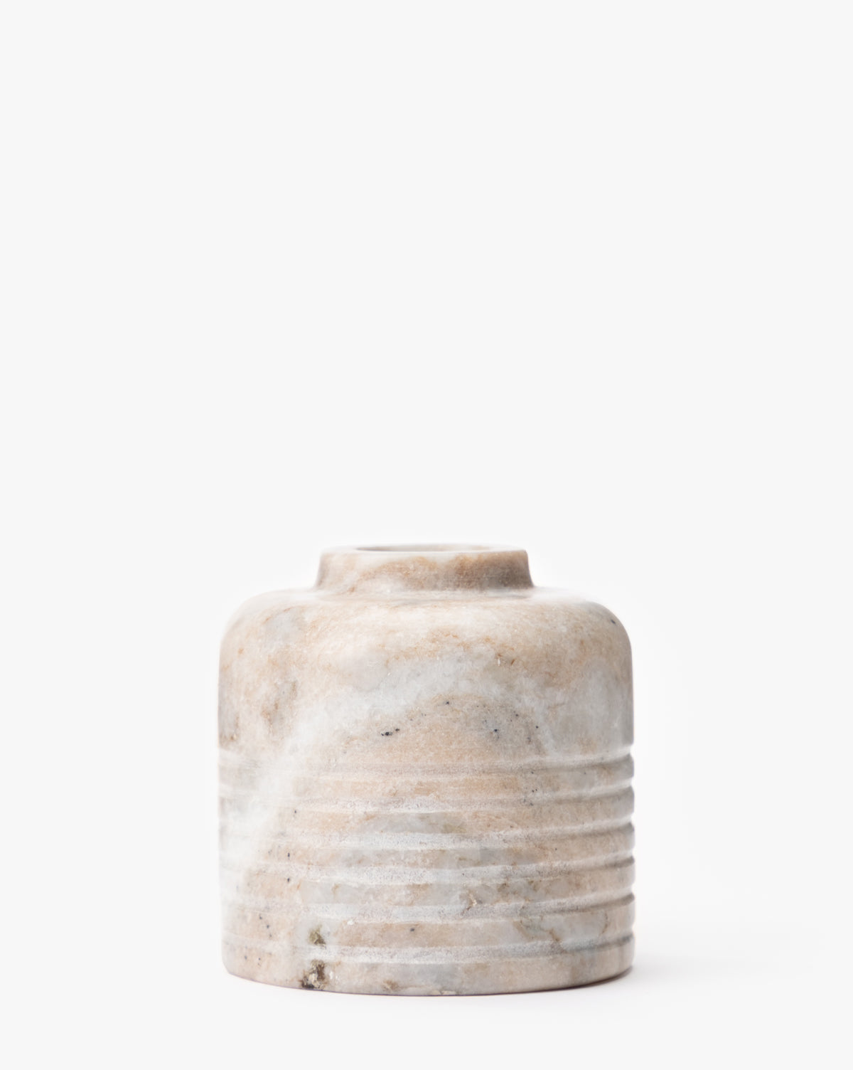 The Stinson Marble Bud Vase is a small, round vase with a marbled beige and white finish and horizontal ridges on the lower half. It features an elegant short, narrow neck and is displayed against a plain white background, by McGee & Co.