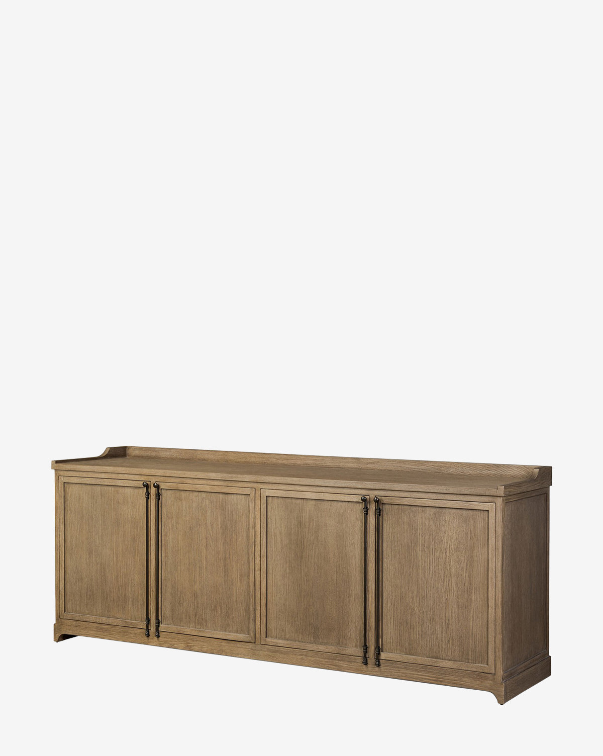 The Stonington Oak Sideboard is a long, rectangular piece with four panel doors, black metal handles, a weathered washed oak finish, and a raised back edge for a vintage-inspired look, by McGee & Co.