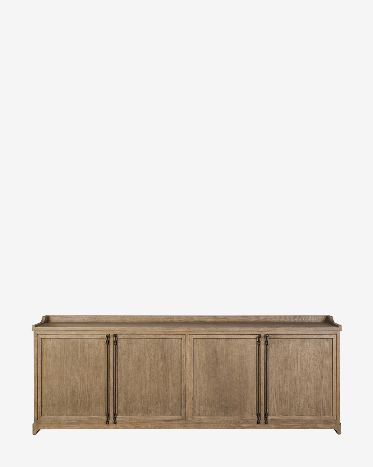 The Stonington Oak Sideboard features a vintage-inspired design with a light brown weathered washed oak finish, four cabinet doors, and long black metal handles, shown against a plain white background by McGee & Co.