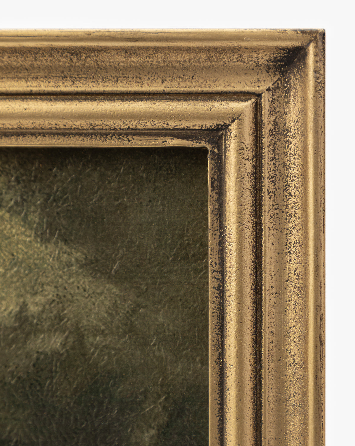 Close-up of the top right corner of a gold wood frame, its textured finish adding elegance. Inside, Storm on the Lake—a dark, moody artwork—appears against a plain white background, hinting at a dramatic landscape.
