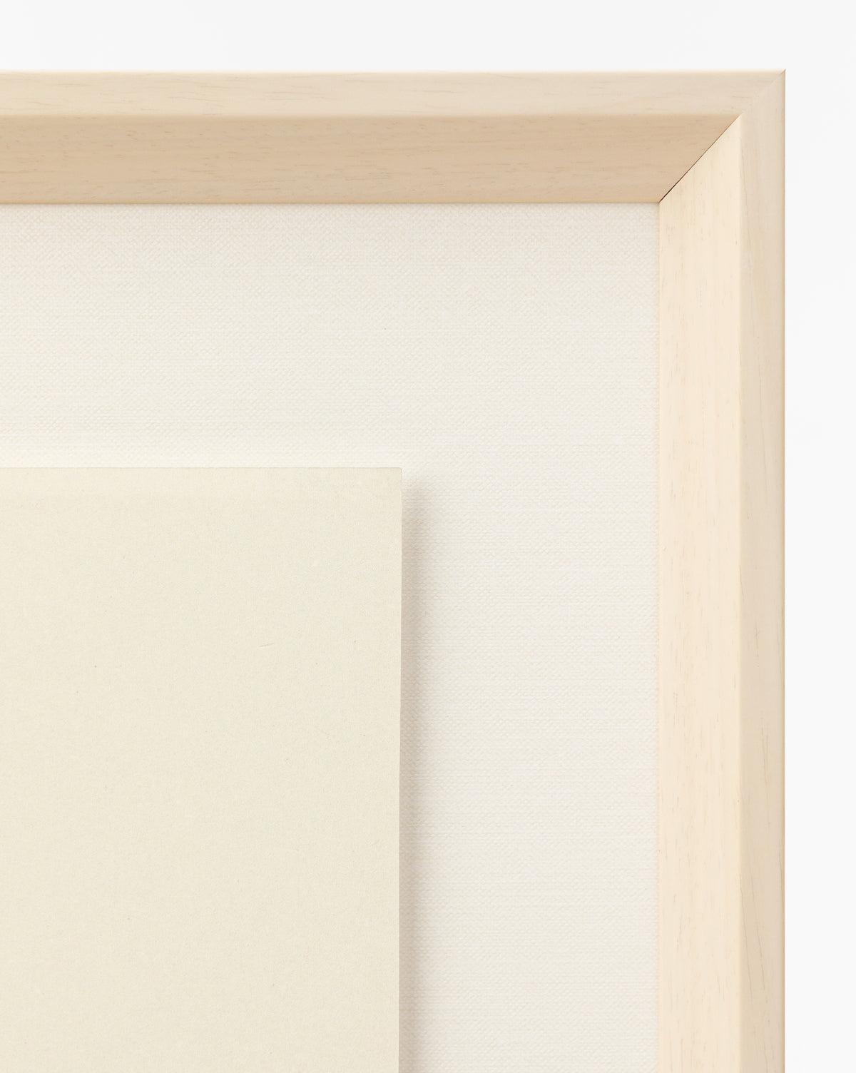 Close-up of two layered blank canvases with light wooden frames, ideal for a childs room or as the perfect base for your Strawberry Collage, displayed against a plain white background, by McGee & Co.