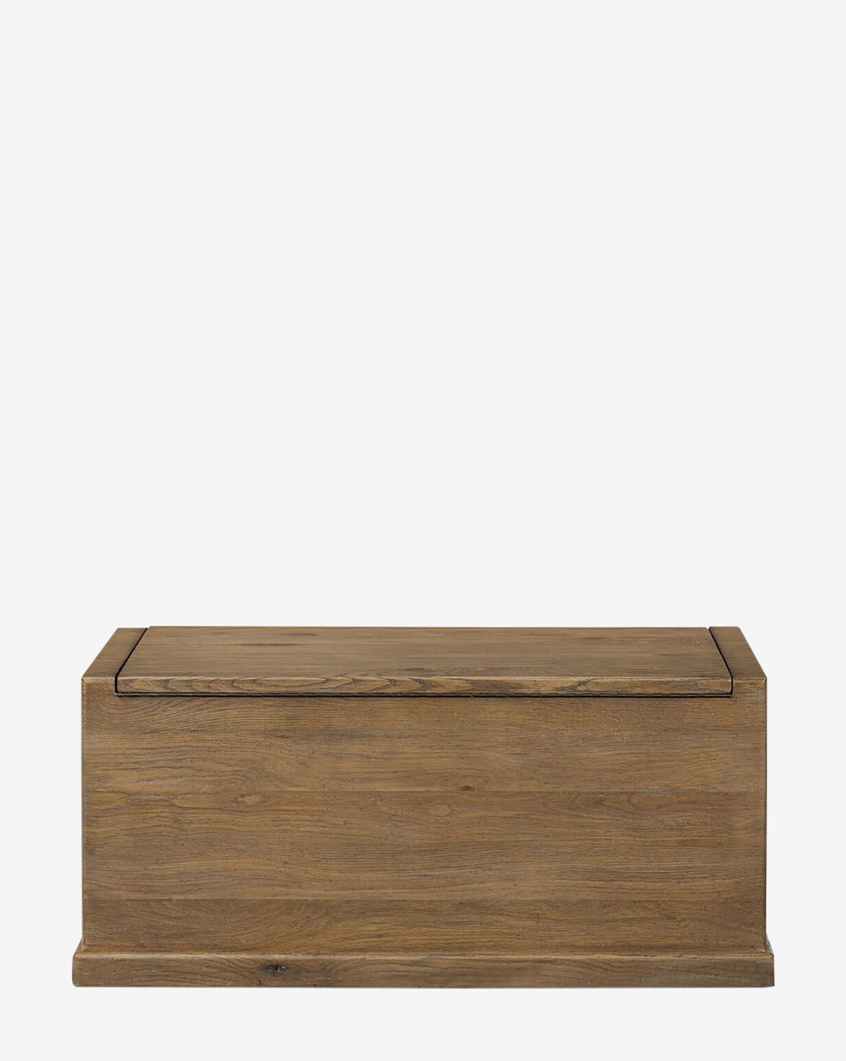 The Sutton Trunk is a rectangular storage chest with a flat lid and simple design, crafted from weathered oak, shown against a plain white background, by McGee & Co.