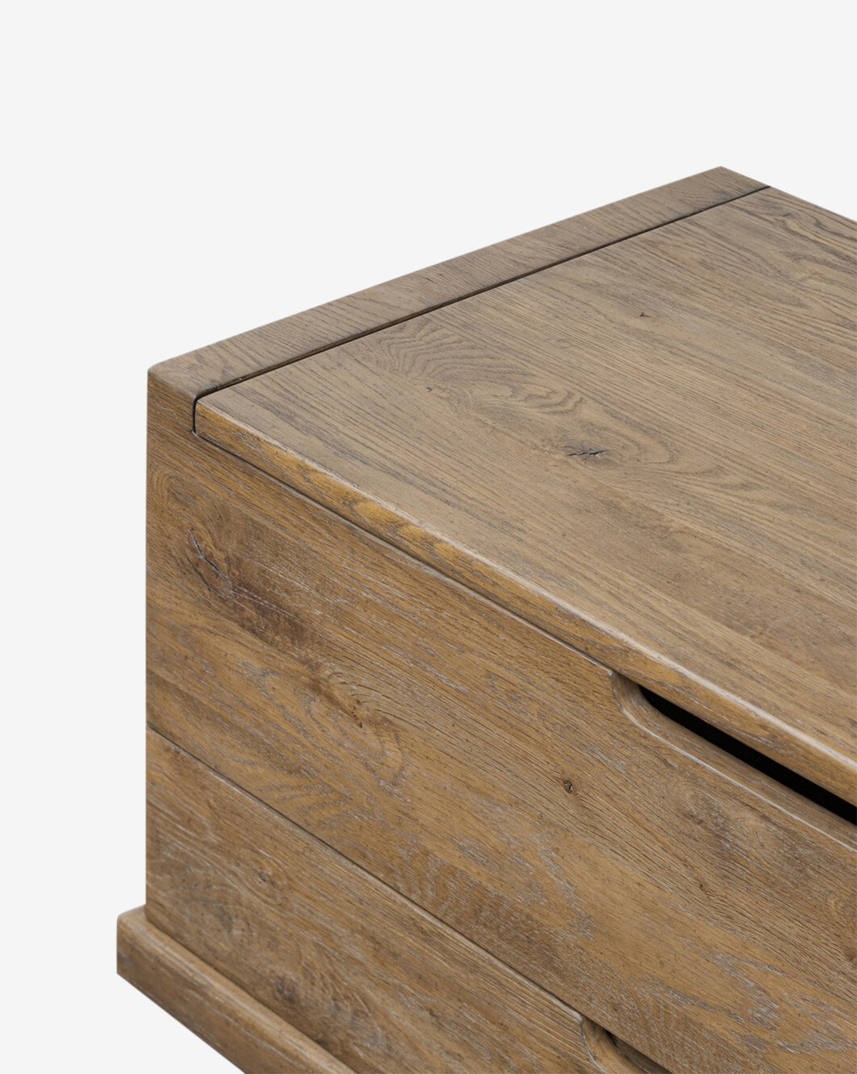 A close-up of the Sutton Trunk highlights its weathered oak finish, clean lines, and modern design with functional storage drawers, by McGee & Co.
