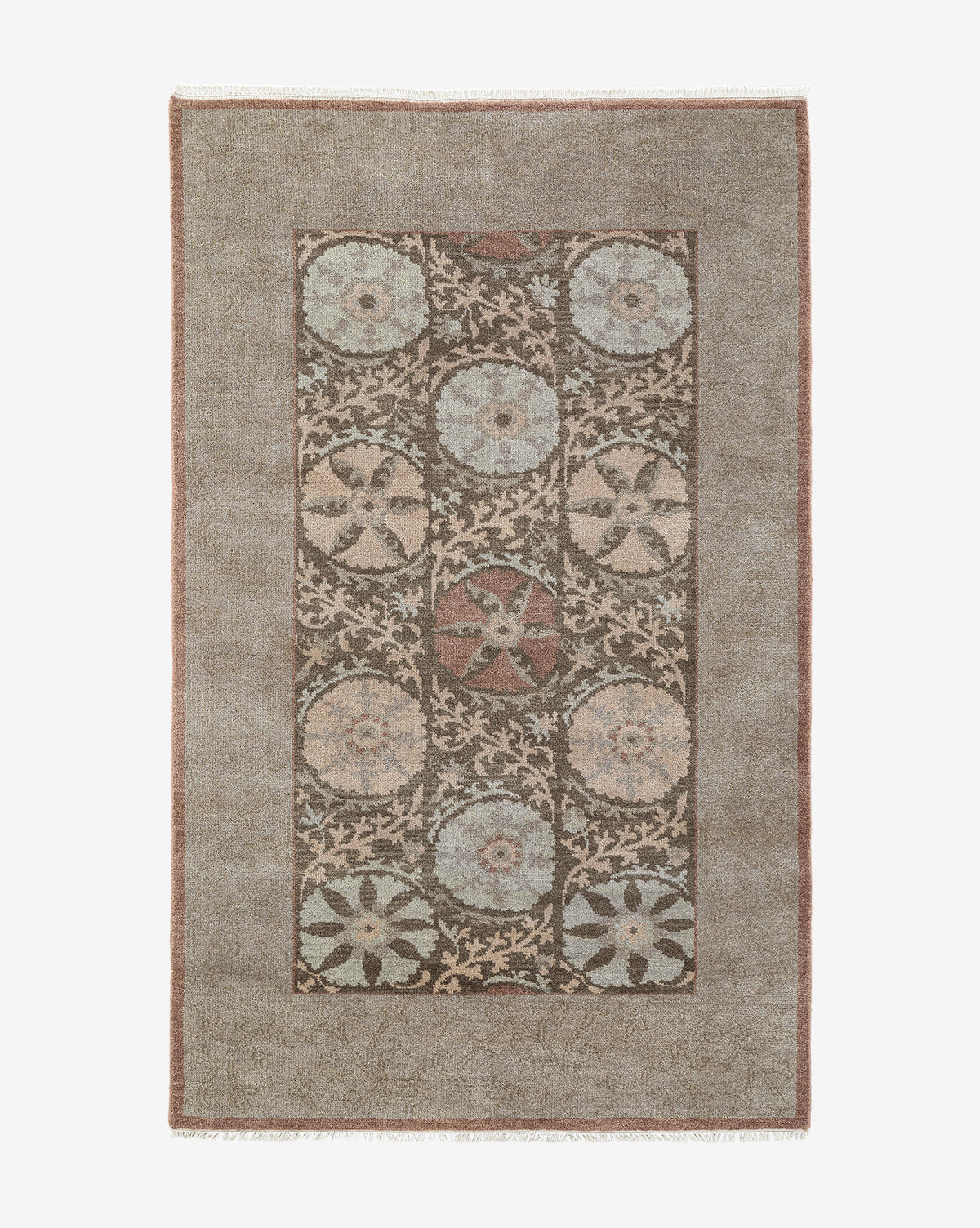 The Suzani Hand-Knotted Wool Rug displays circular floral medallions in muted blue, beige, and brown within a central panel, framed by a plain taupe border, by McGee & Co.