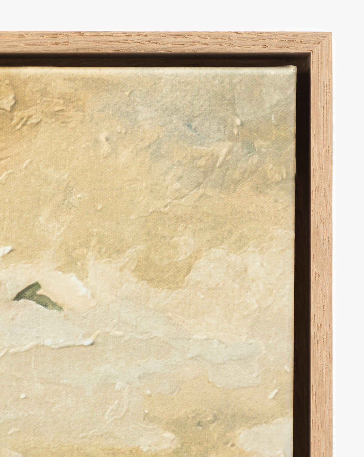 A close-up of the top right corner of the Swallows at Dusk canvas print shows textured beige and light brown hues, elegantly framed in white oak, by McGee & Co.