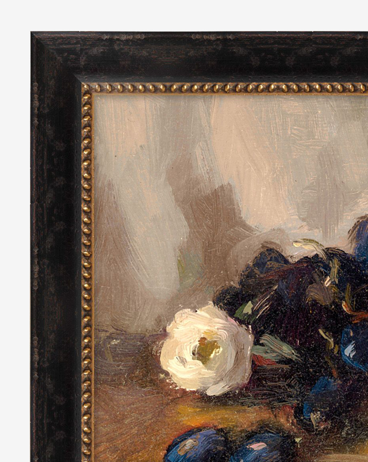 A close-up of “Tableside” by Joyce Washor reveals a white flower and deep purple-blue fruits on a muted background, all elegantly presented in an ornate dark frame with gold beaded detailing, by McGee & Co.