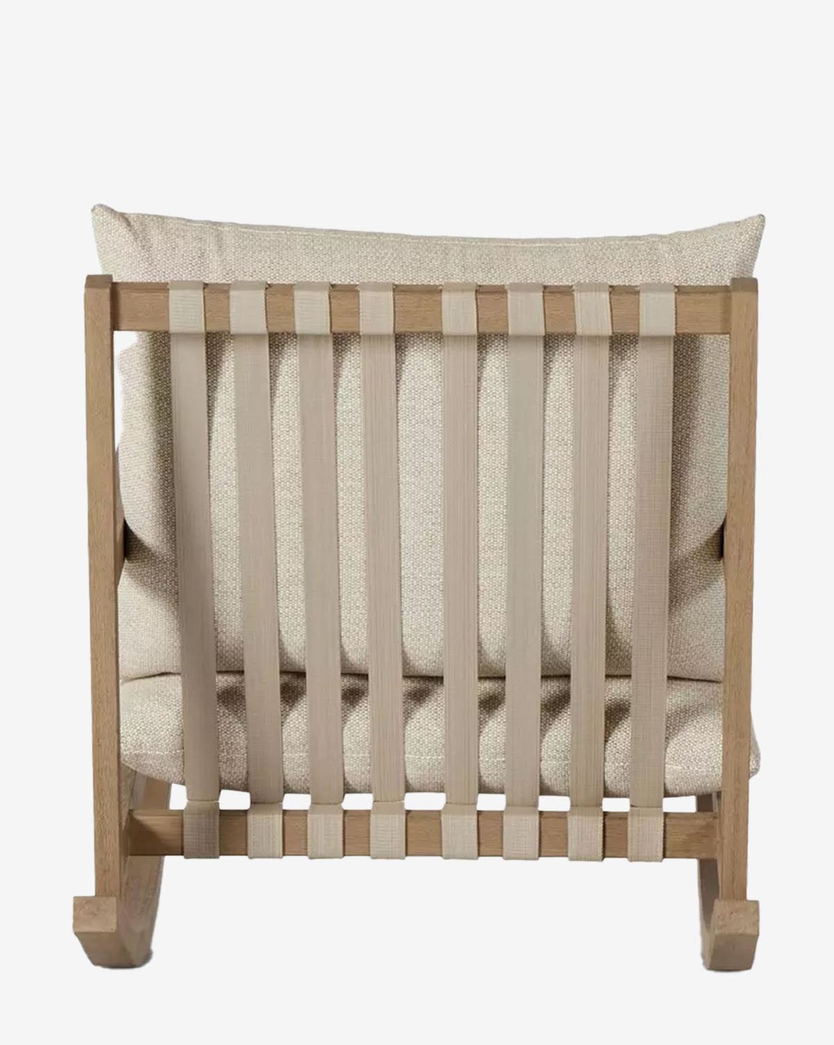 The Talia Outdoor Rocking Chair features a modern teak wood frame, vertical beige fabric back straps, and a plush beige cushion. Shown from the back to highlight its design and comfort—ideal for backyard relaxation by McGee & Co.