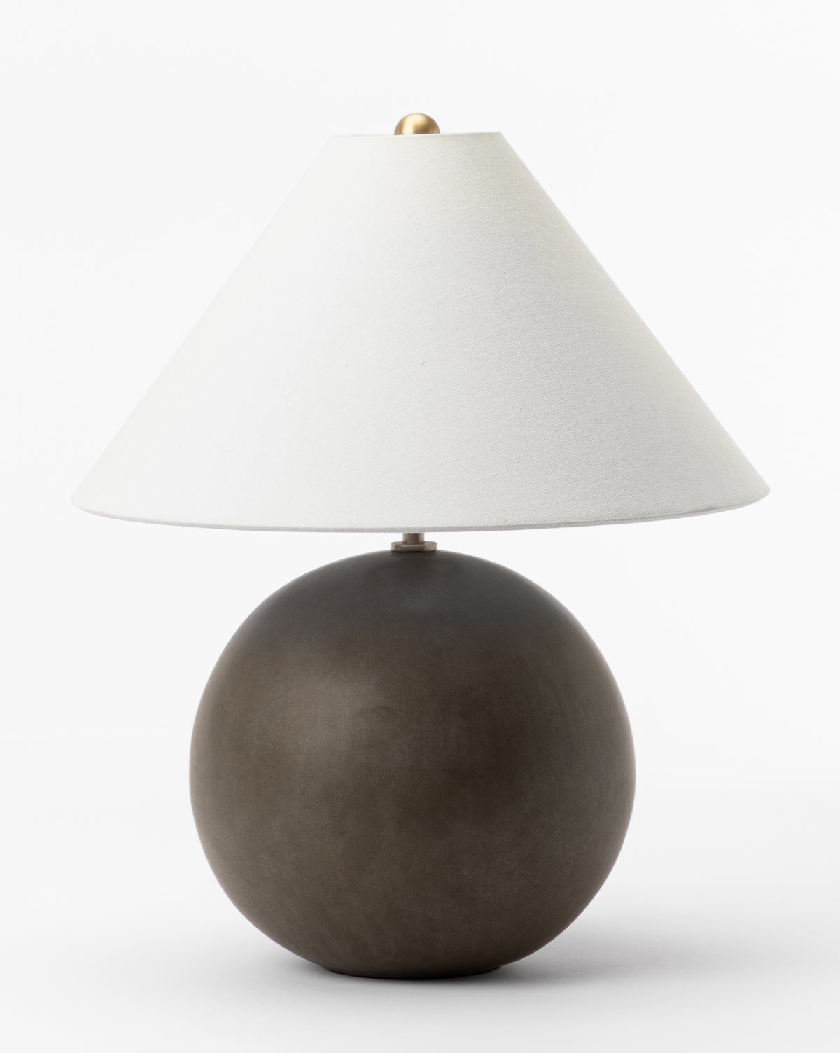 The Tess Ceramic Table Lamp features a round dark brown base and a wide white cone-shaped shade, shown against a plain white background by McGee & Co.