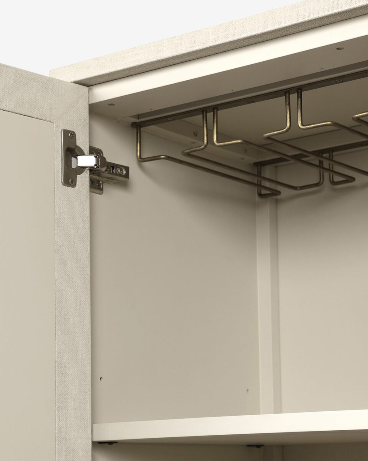 The Thaddeus Cabinet features a modern classic design with an open cabinet, metal hinges, an empty shelf, and an overhead metal rack for added storage in the light-toned upper section, by McGee & Co.