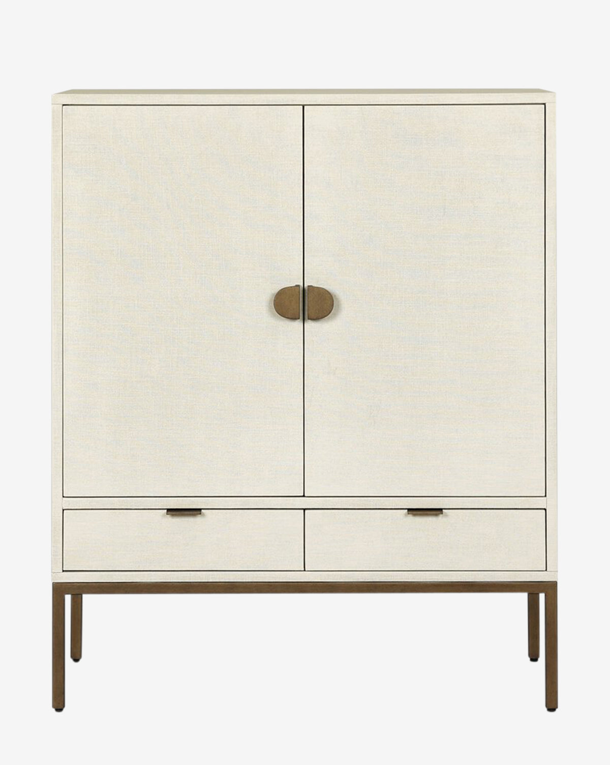 The Thaddeus Cabinet features a modern classic design with two doors, round brass handles, two lower drawers, rectangular brass pulls, slim metal legs, and provides extra storage for contemporary spaces, by McGee & Co.