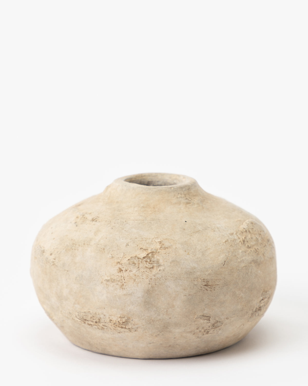 A set of three round, rustic Thalia Bud Vases crafted from beige terracotta clay, each featuring a small opening and natural textured details, displayed against a plain white background.