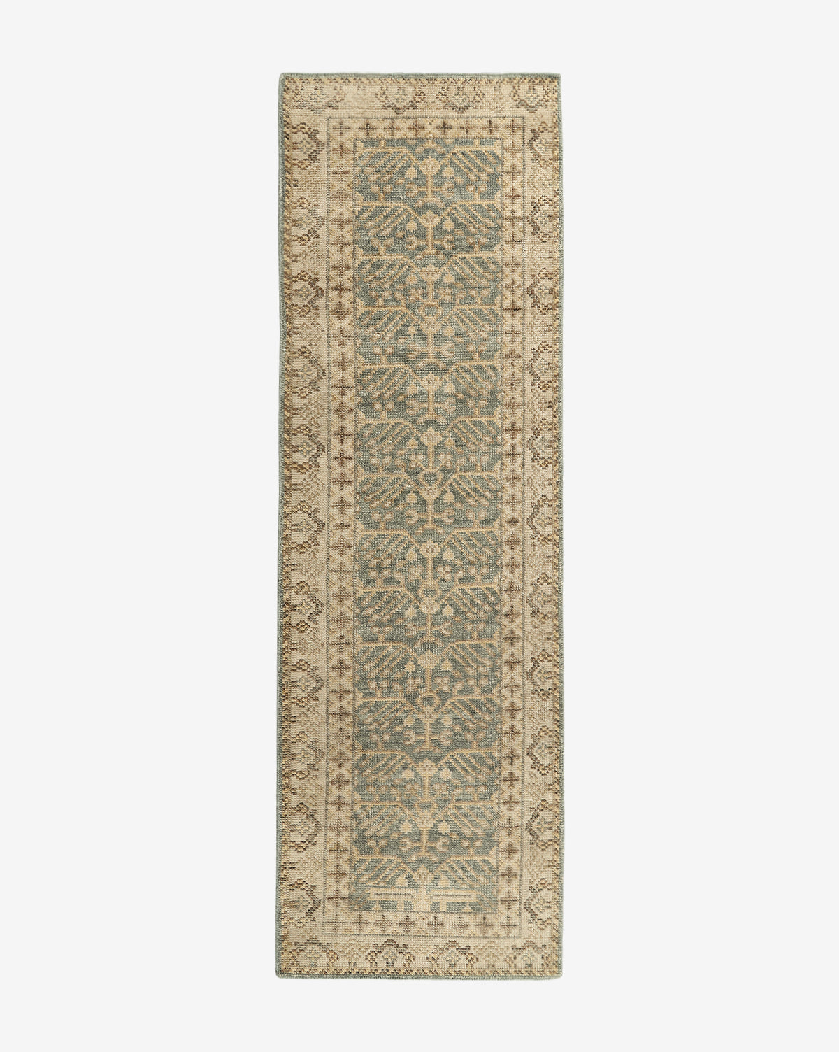 The Thames Hand-Knotted Rug is a rectangular, antique-inspired runner featuring a central blue and beige pattern with symmetrical, intricate designs and a decorative beige border—ideal for adding luxury to your home decor, by McGee & Co.