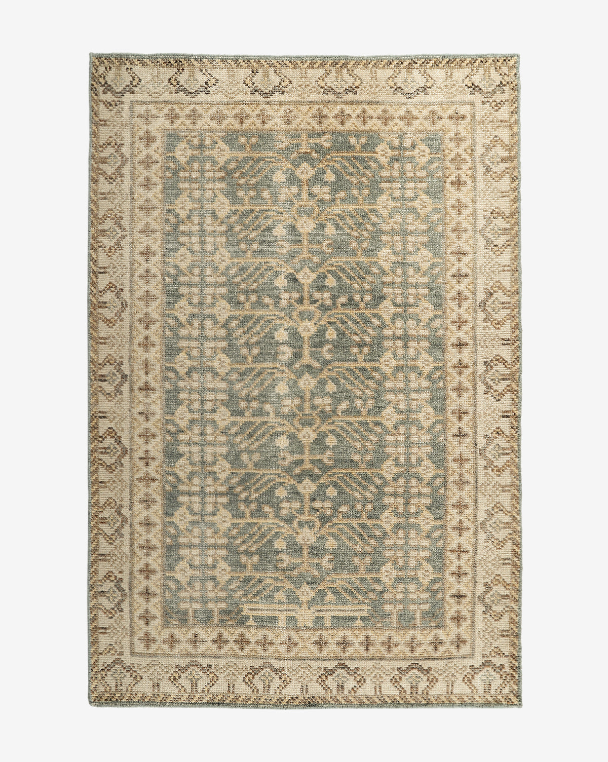 The Thames Hand-Knotted Rug features a rectangular, antique-inspired design with ornate floral and geometric patterns in muted blue, beige, and cream tones. Its decorative border and vintage style make it ideal for luxury home decor, by McGee & Co.