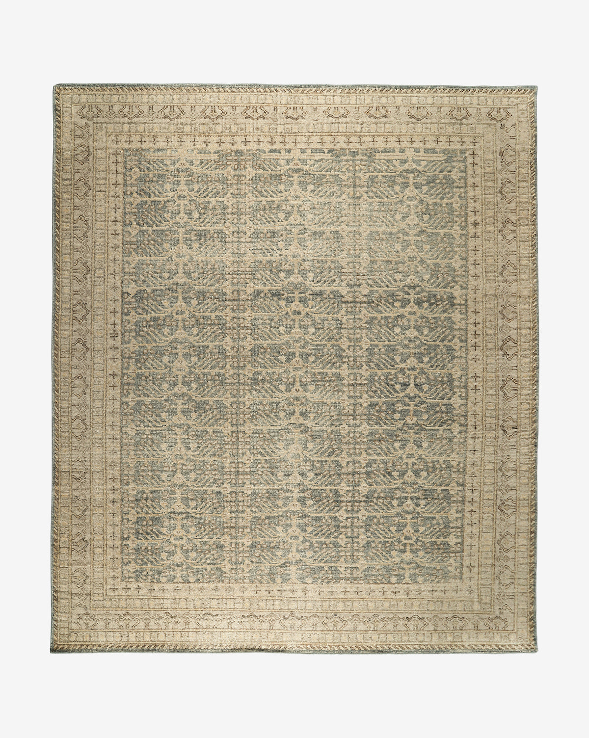 The Thames Hand-Knotted Rug is a rectangular, antique-inspired piece featuring an intricate, symmetrical pattern in muted beige and gray with a detailed border and repeating central motif—ideal for luxury home decor, by McGee & Co.