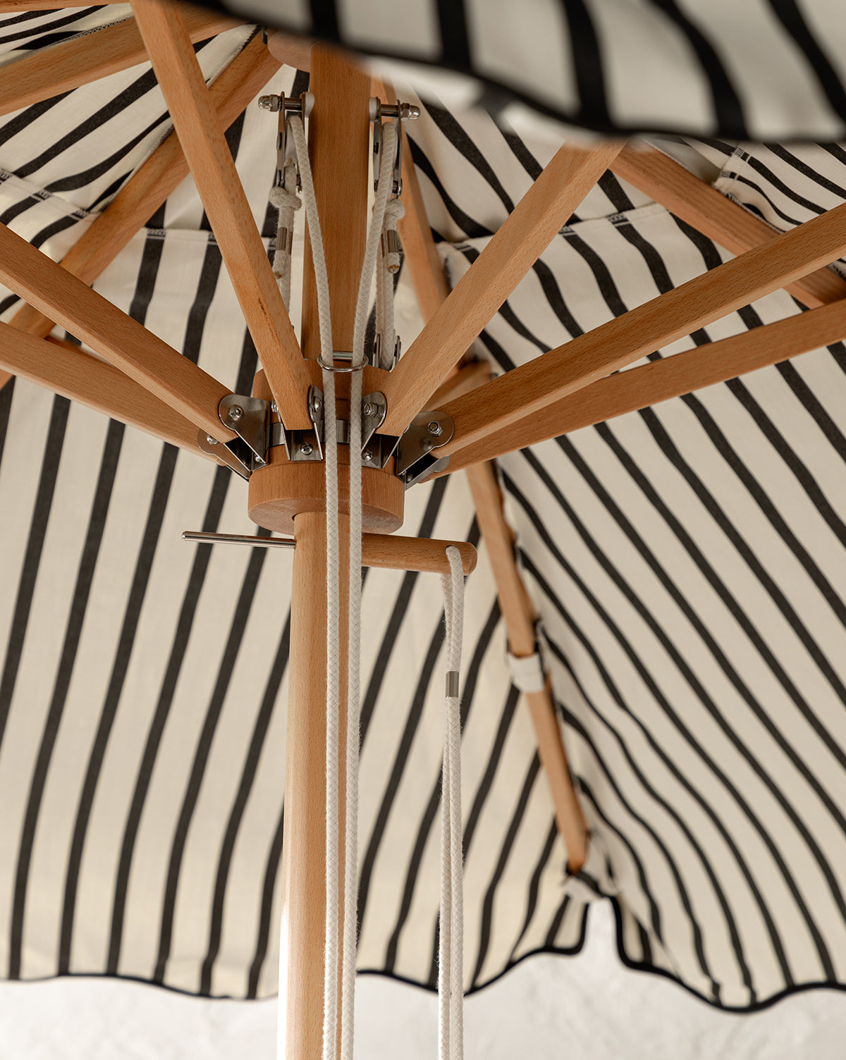 Close up Monaco Market Umbrella bamboo base holding up the canopy from McGee & Co.