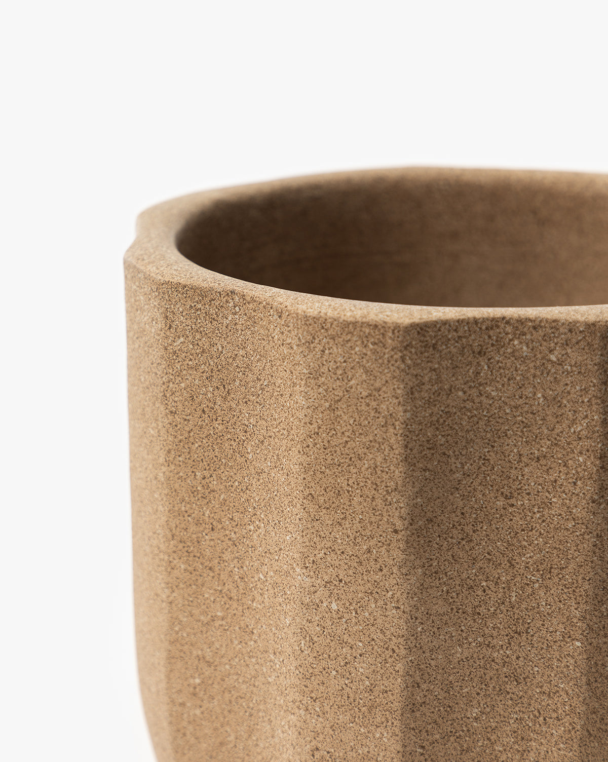 Close up of a small Trella Planter, approx. 6” Dia. x 7” H, in textured terracotta finish, from McGee & Co.