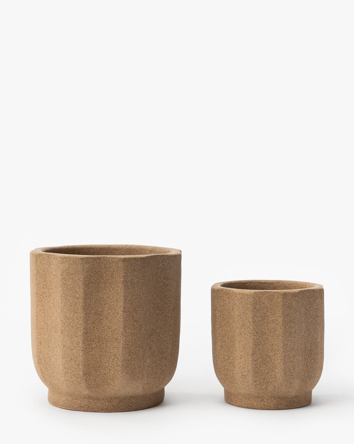 Small Trella Planter, approx. 6” Dia. x 7” H, and in 8” Dia. x 9” H, in textured terracotta finish, from McGee & Co.