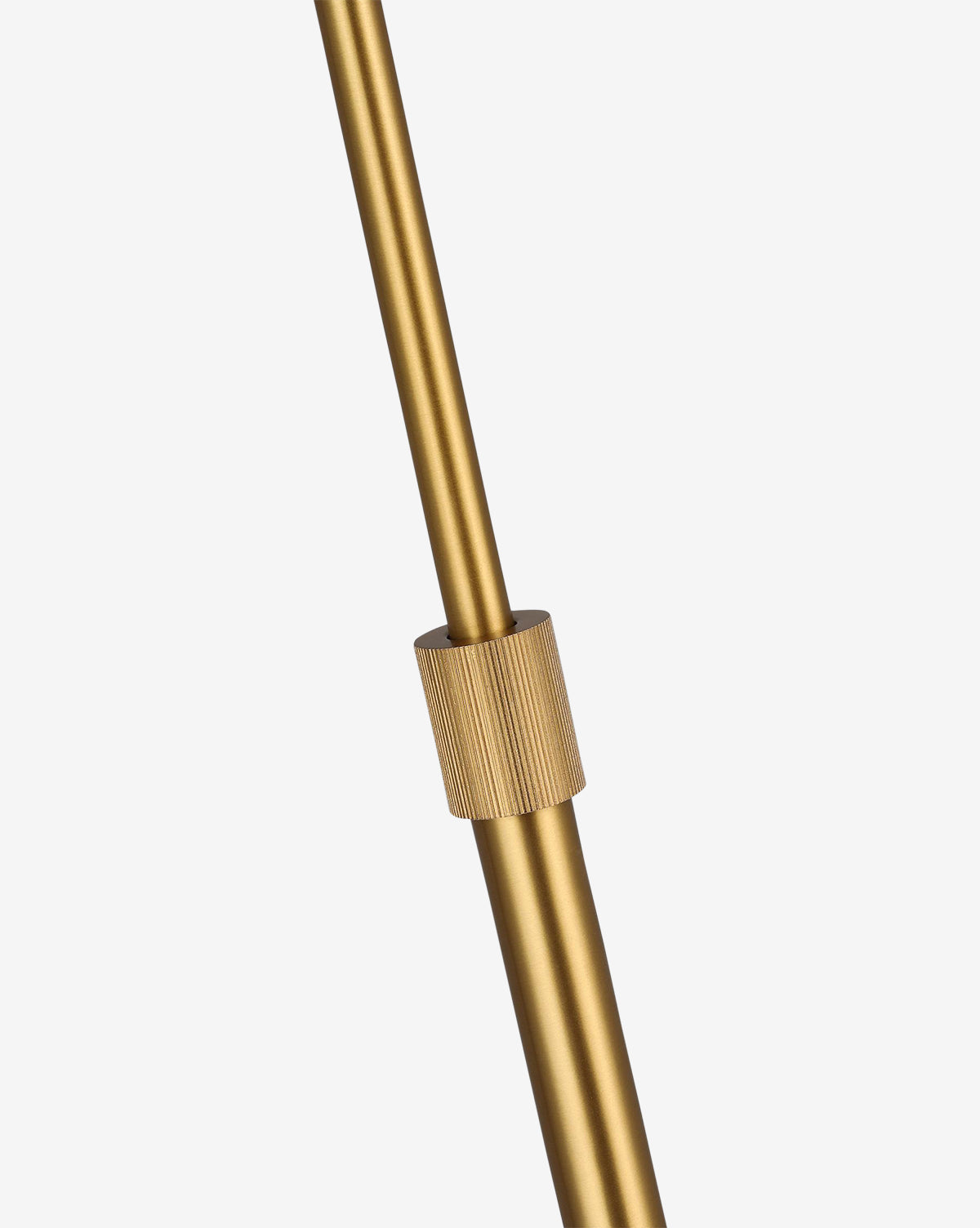 Close-up of the Tresa Floor Lamp’s adjustable gold metal rod with a threaded cylindrical knob and burnished brass finish, set against a plain white background—perfect for elevating any living space, by McGee & Co.