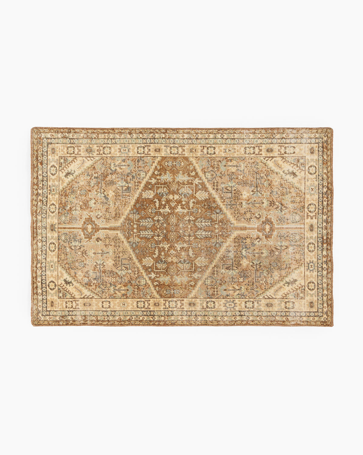 The Tulie Hand-Knotted Wool Rug features a rectangular, vintage-inspired design with intricate floral and geometric patterns in beige, brown, and cream, plus a thick decorative border and distressed detailing for an antique look, by McGee & Co.