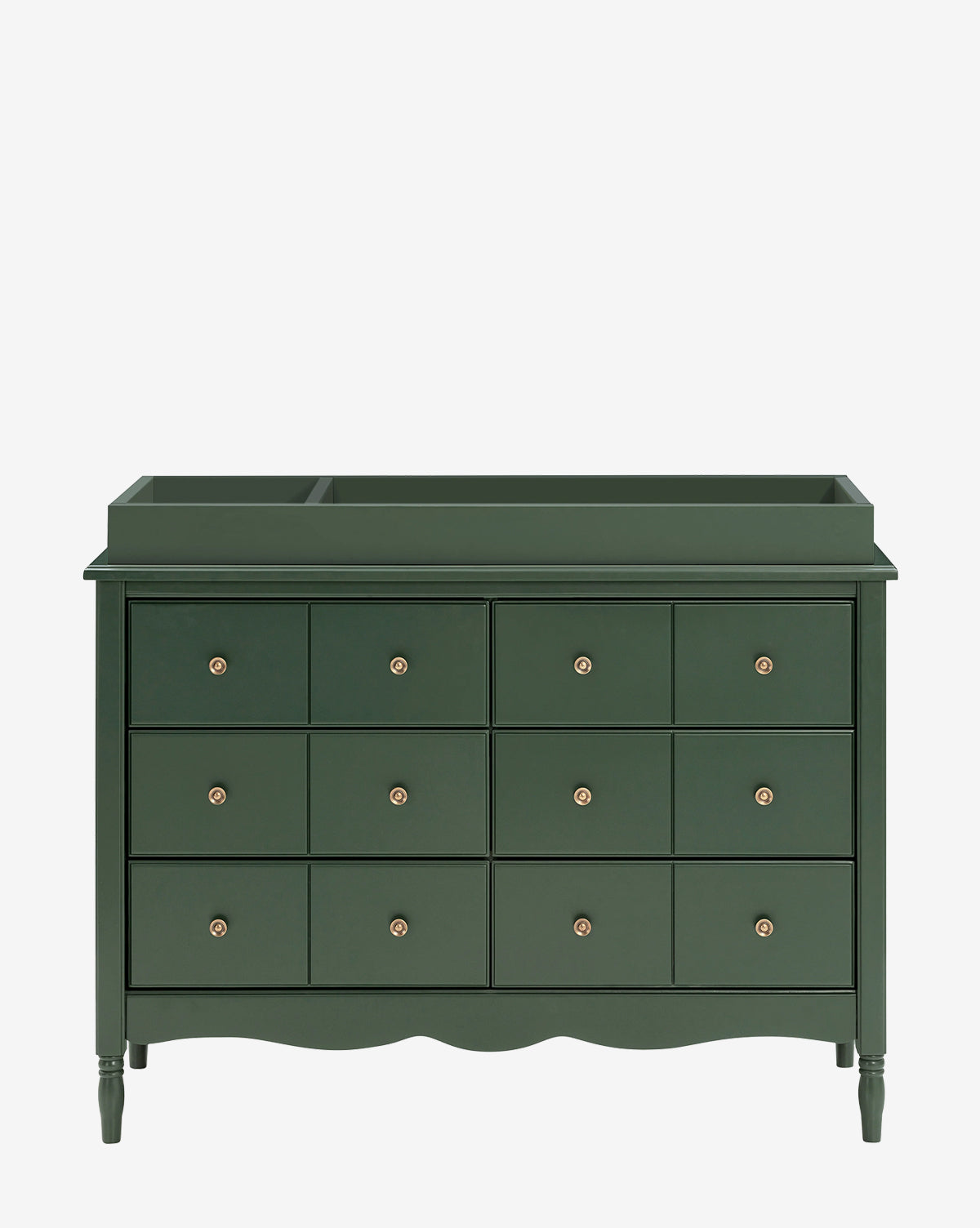 A Universal Wide Removable Changing Tray sits atop a dark green dresser with nine drawers, brass knobs, scalloped bottom edge, and raised tray, perfect for organizing baby essentials, set against a plain white background by McGee & Co.
