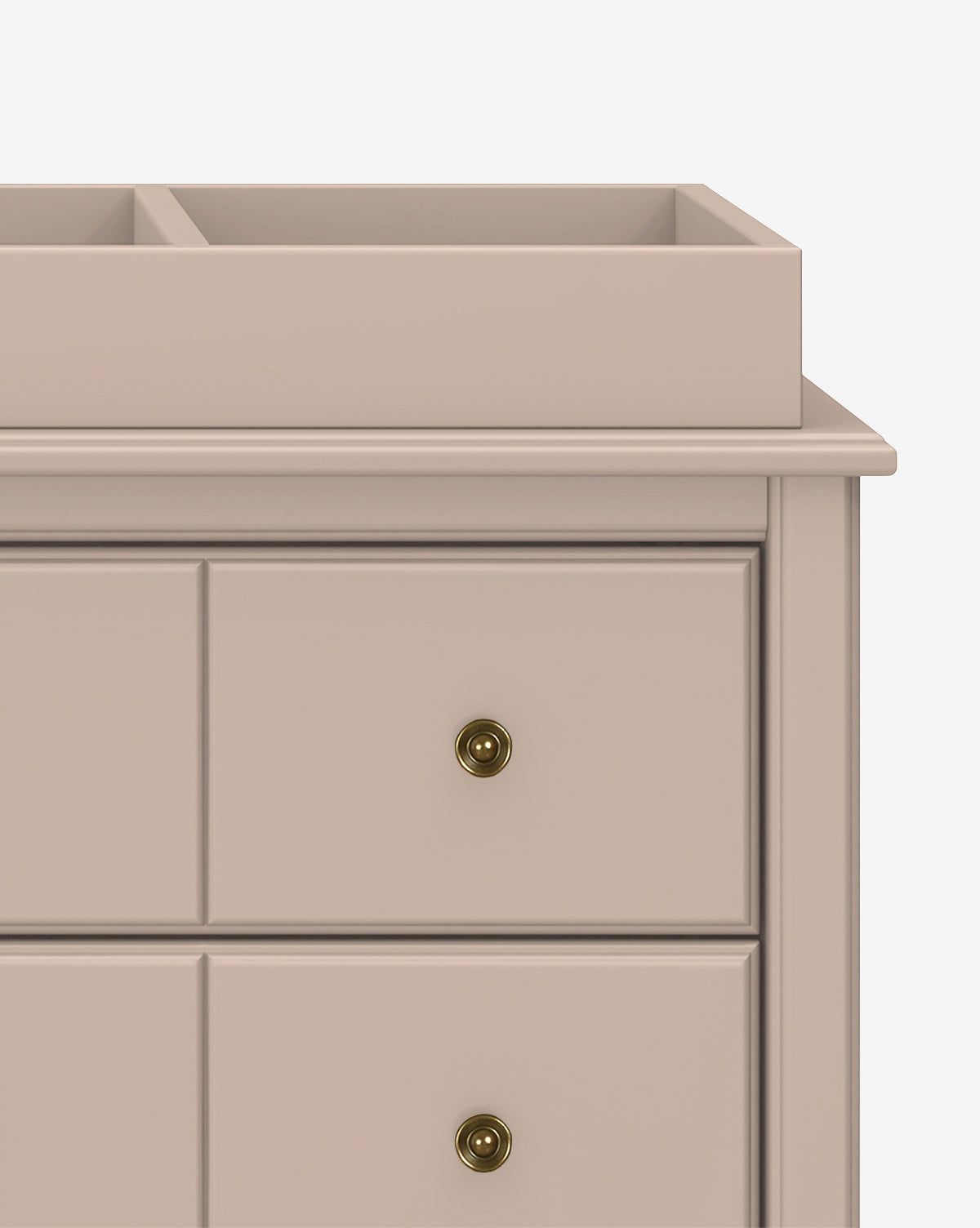 A close-up of the Universal Wide Removable Changing Tray atop a beige dresser with three drawers, each with a brass knob. The raised-edged tray keeps baby essentials secure. The background is plain white, by McGee & Co.