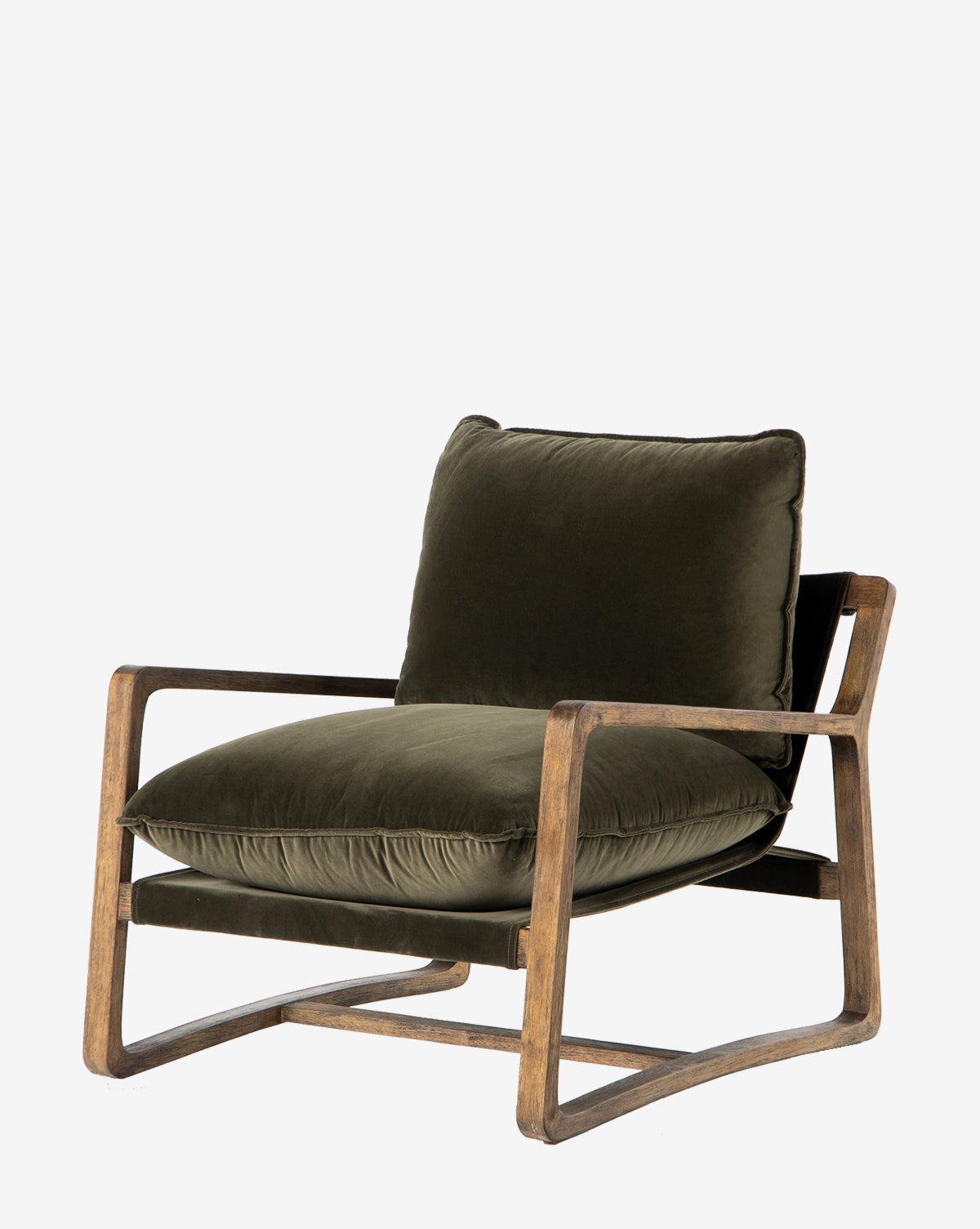 The Ura Lounge Chair features a solid ash frame with angled armrests and legs, plus deep green velvet cushions. Its sleek, minimalist design makes it stand out, especially against a white background.