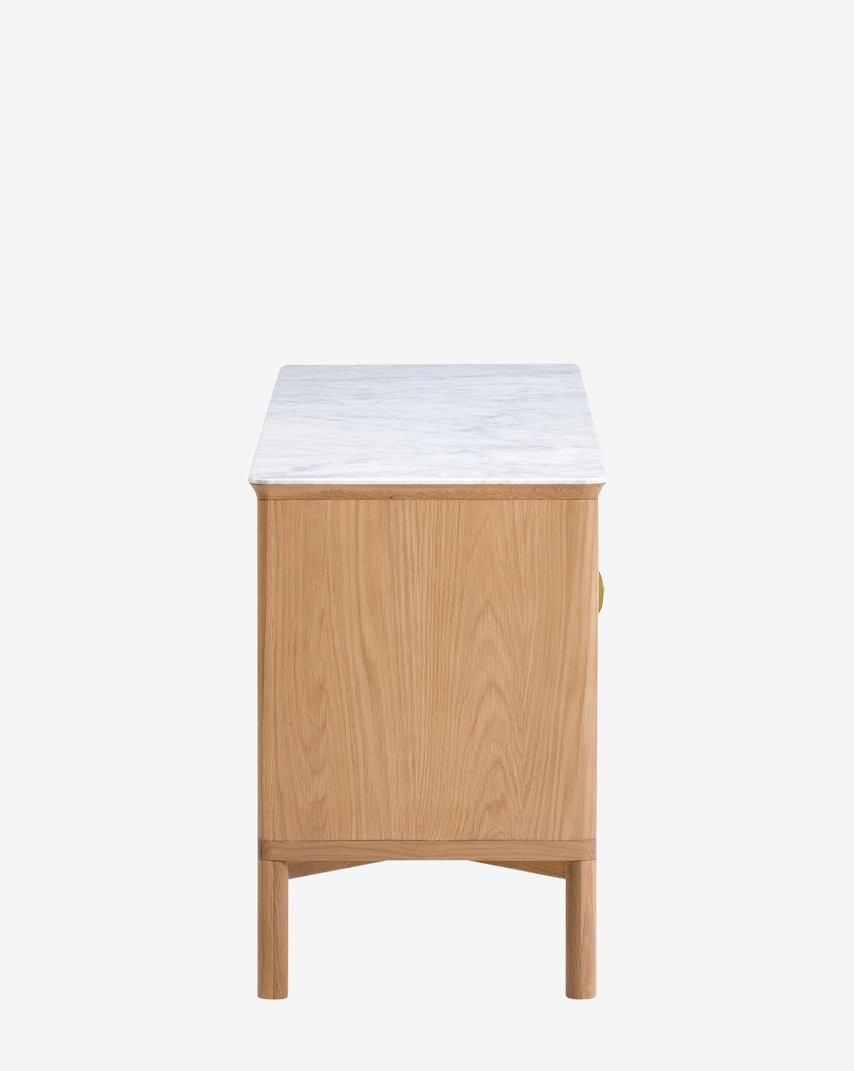 Side view of the Vale Sideboard with a marble top, natural oak wood grain finish, minimalist design, and antique brass hardware, set against a plain white background by McGee & Co.