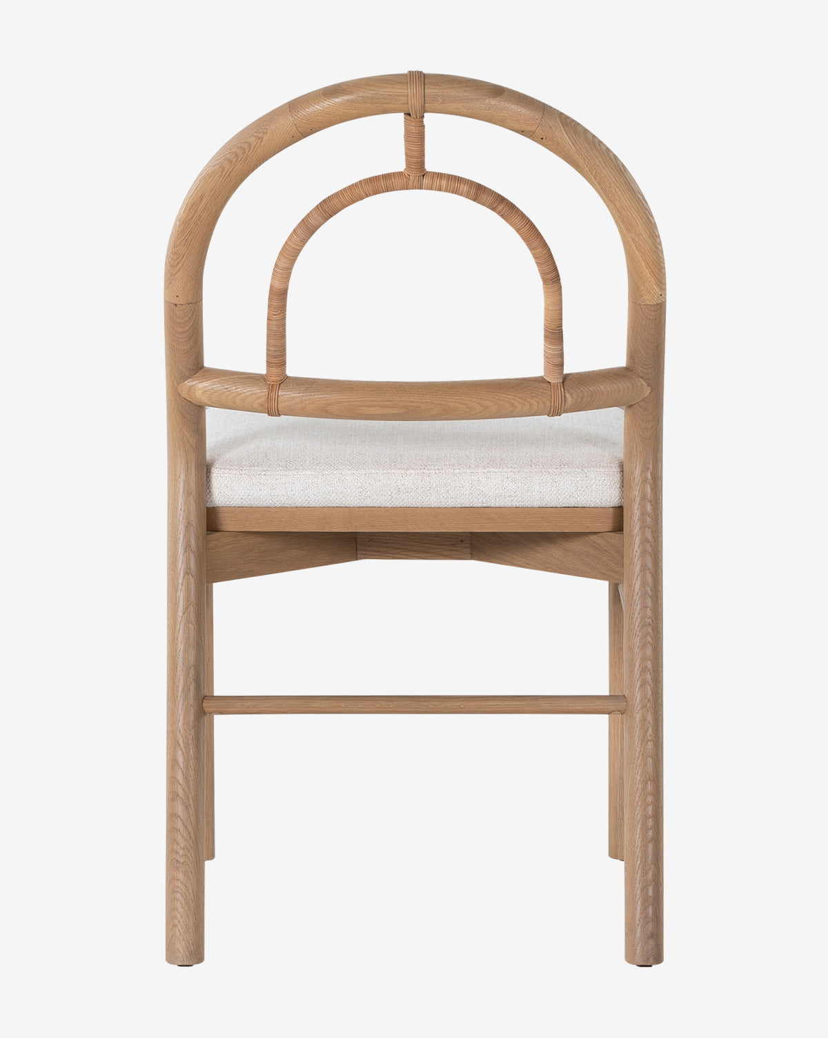 The Vasco Dining Chair features a wooden frame, rounded arched backrest, and light cushioned seat, shown from the back against a plain white background by McGee & Co.